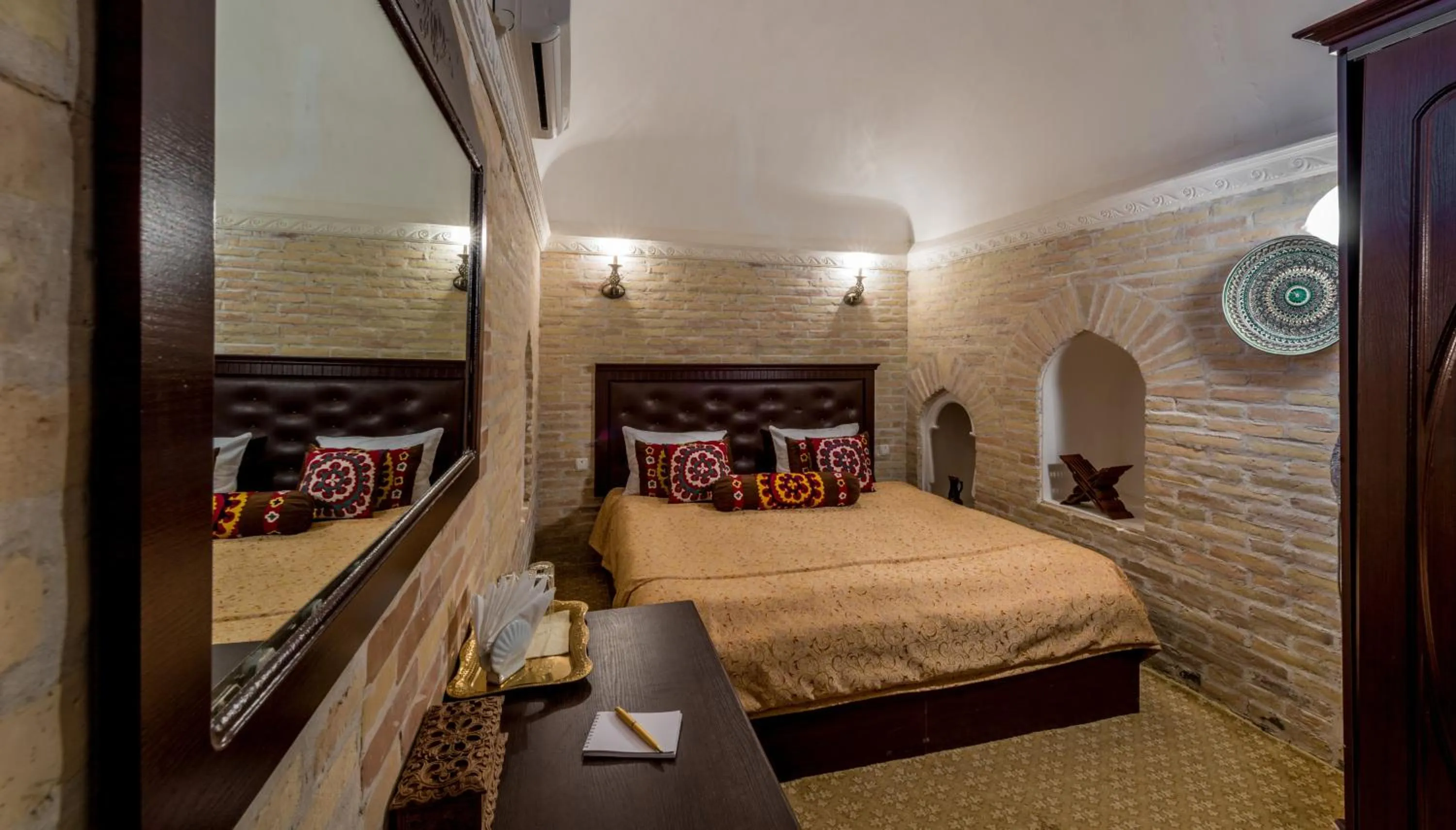 Bed in Orient Star Khiva Hotel- Madrasah Muhammad Aminkhan 1855