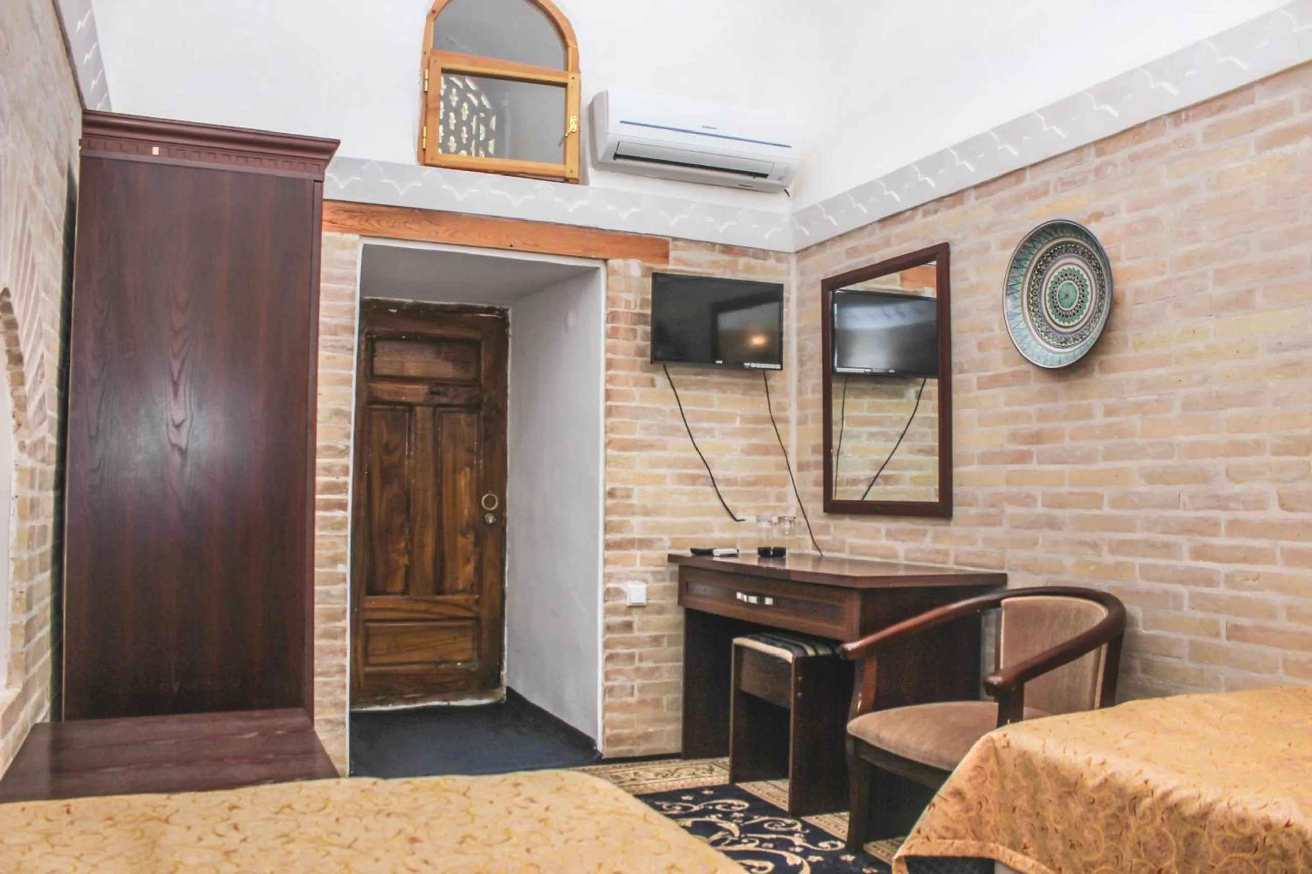 Bed in Orient Star Khiva Hotel- Madrasah Muhammad Aminkhan 1855