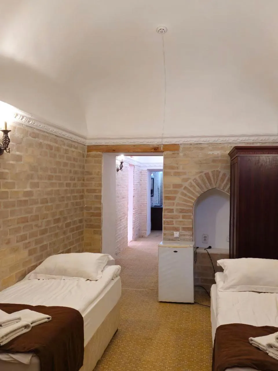 Bed in Orient Star Khiva Hotel- Madrasah Muhammad Aminkhan 1855