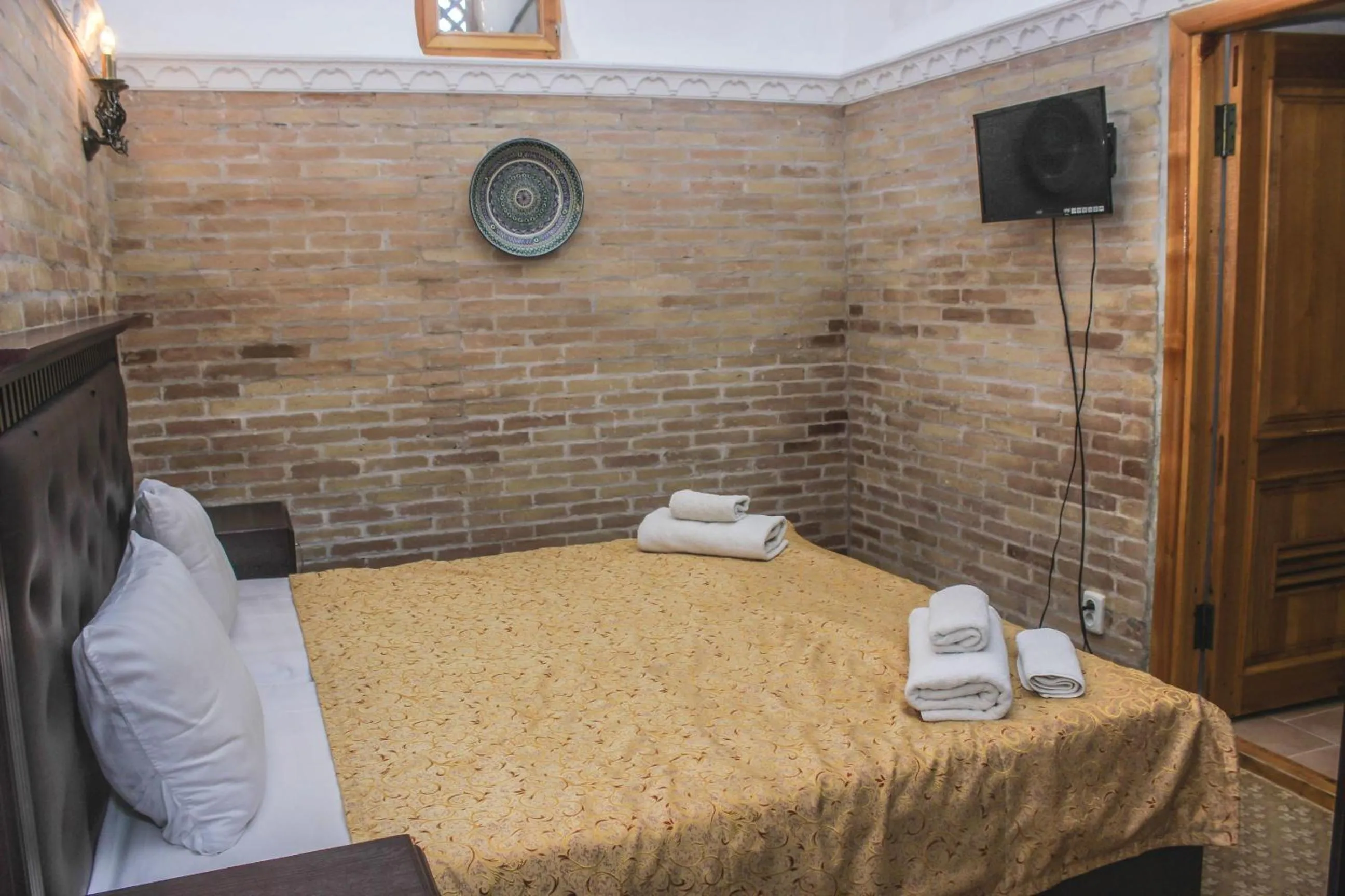 Bed in Orient Star Khiva Hotel- Madrasah Muhammad Aminkhan 1855