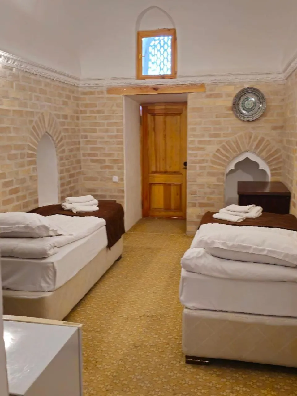 Bed in Orient Star Khiva Hotel- Madrasah Muhammad Aminkhan 1855