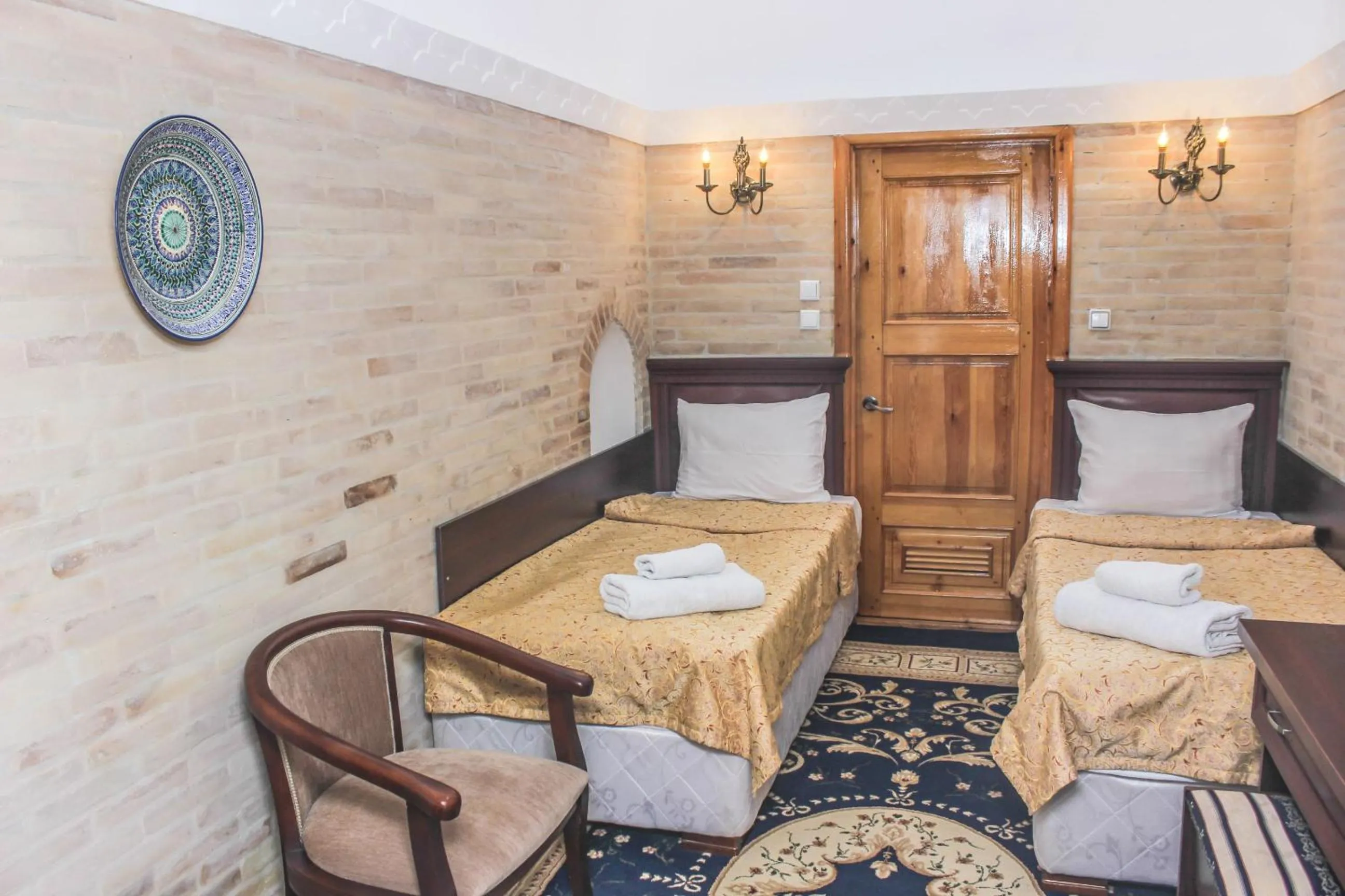 Bed in Orient Star Khiva Hotel- Madrasah Muhammad Aminkhan 1855