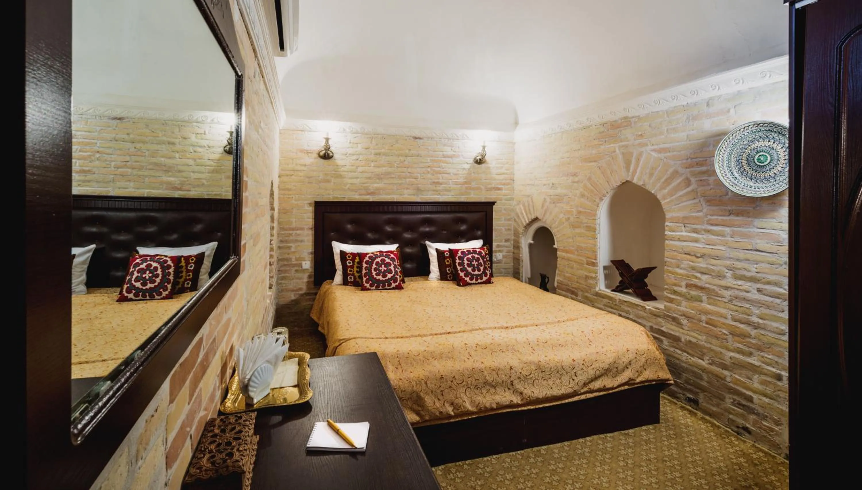 Bed in Orient Star Khiva Hotel- Madrasah Muhammad Aminkhan 1855