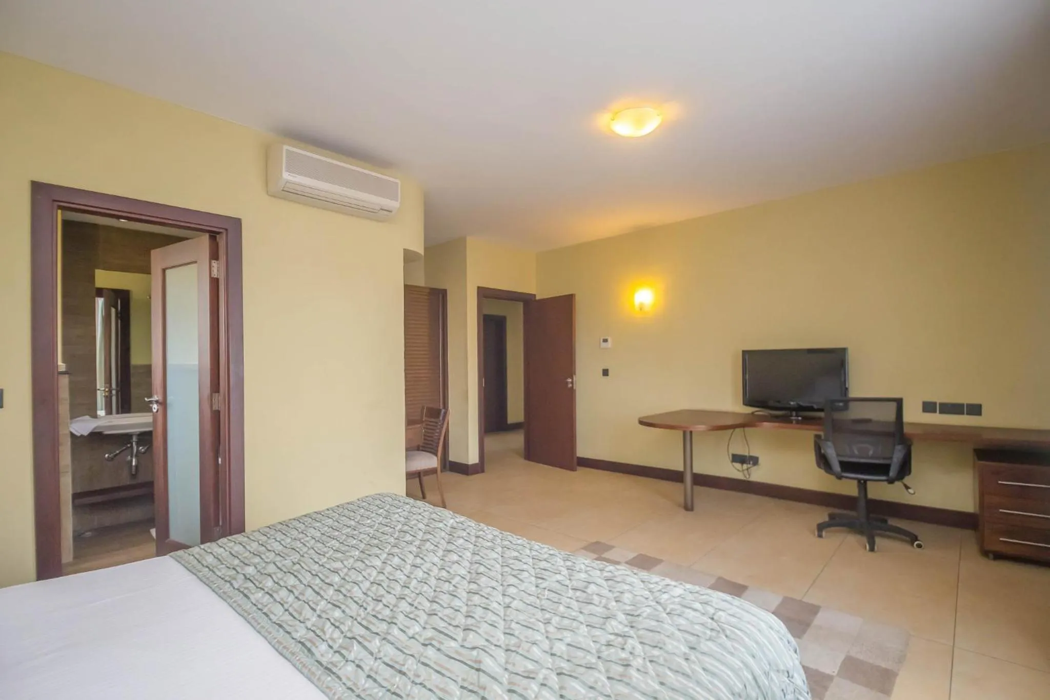 Photo of the whole room, Bed in Taarifa Suites by Dunhill Serviced Apartments