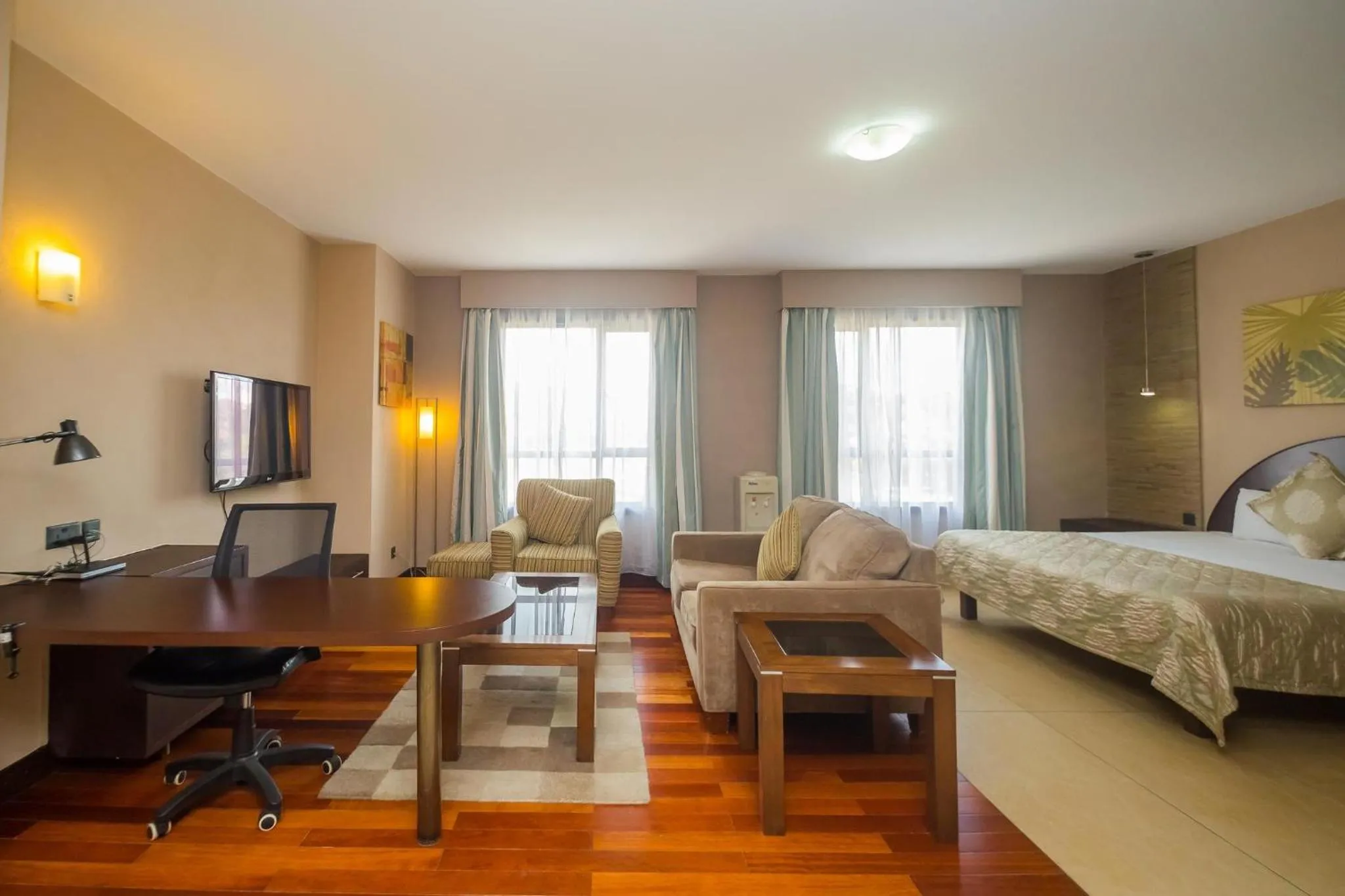 Living room, Bed in Taarifa Suites by Dunhill Serviced Apartments