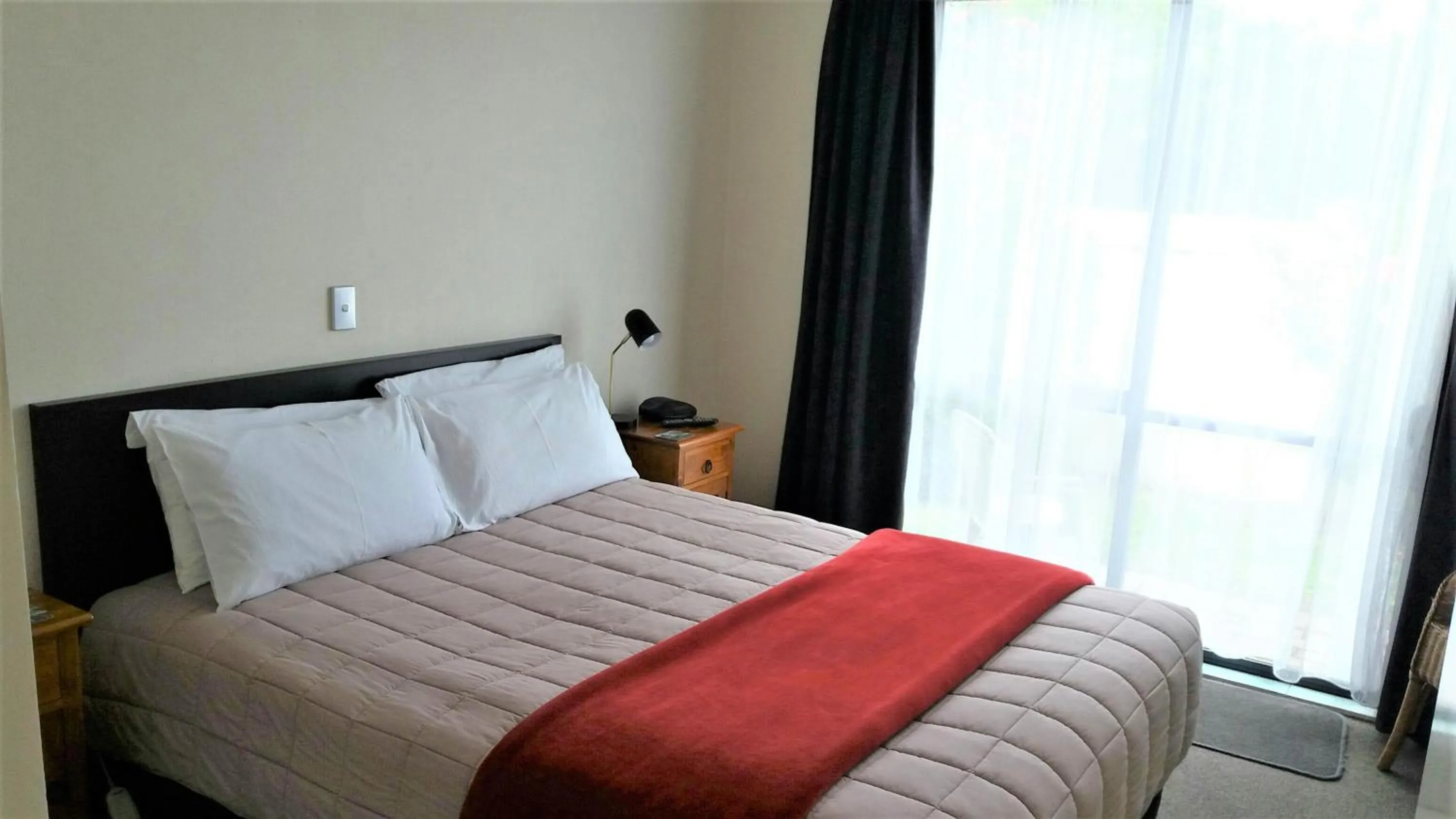 Bed in Bay Palm Motel