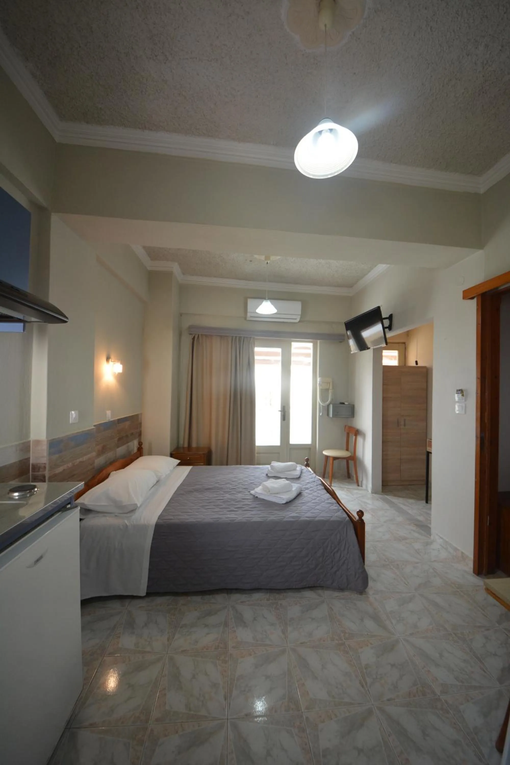 Bed in Bikakis Family Apartments