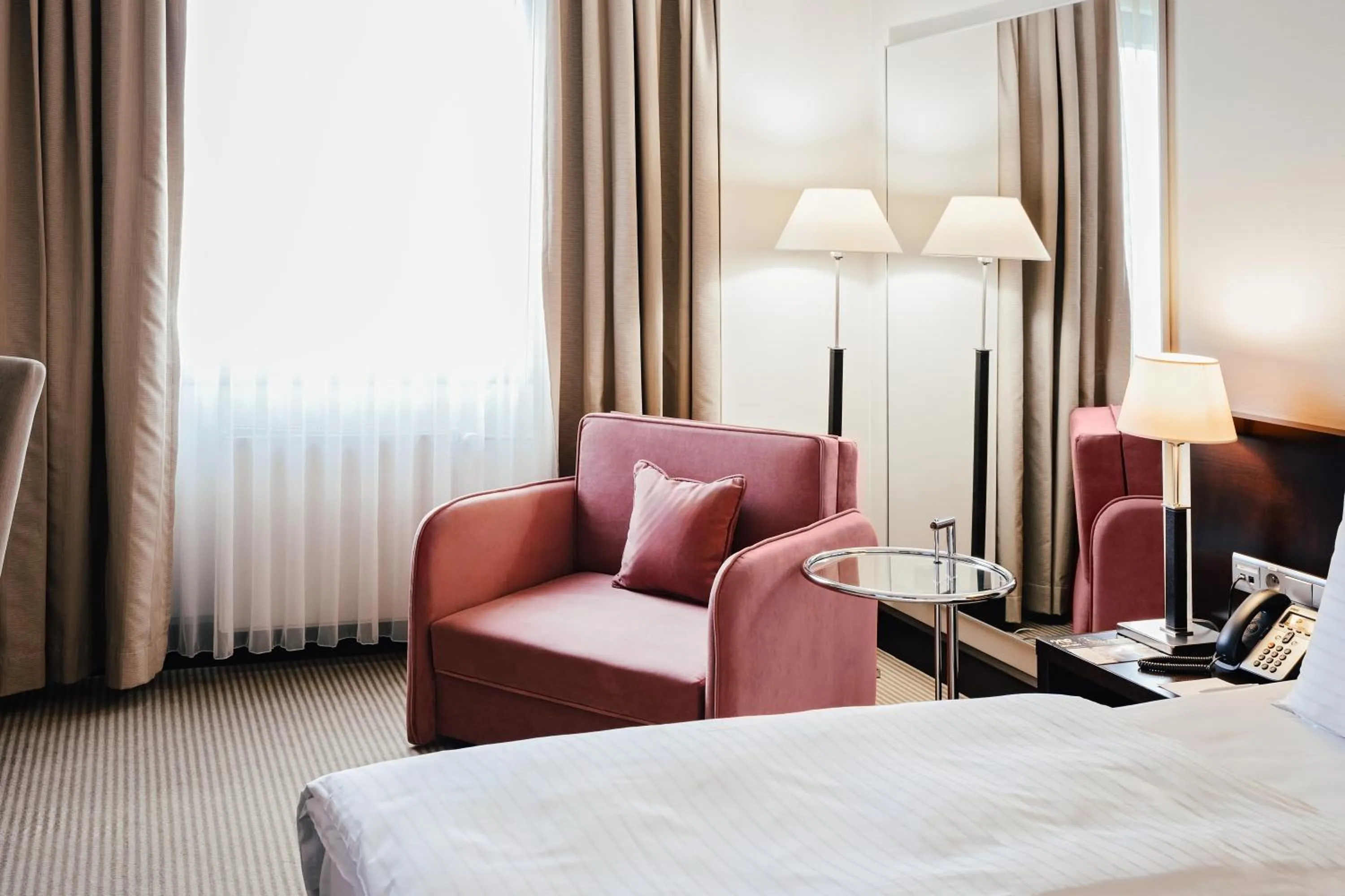 Seating area, Bed in Crowne Plaza Bratislava by IHG