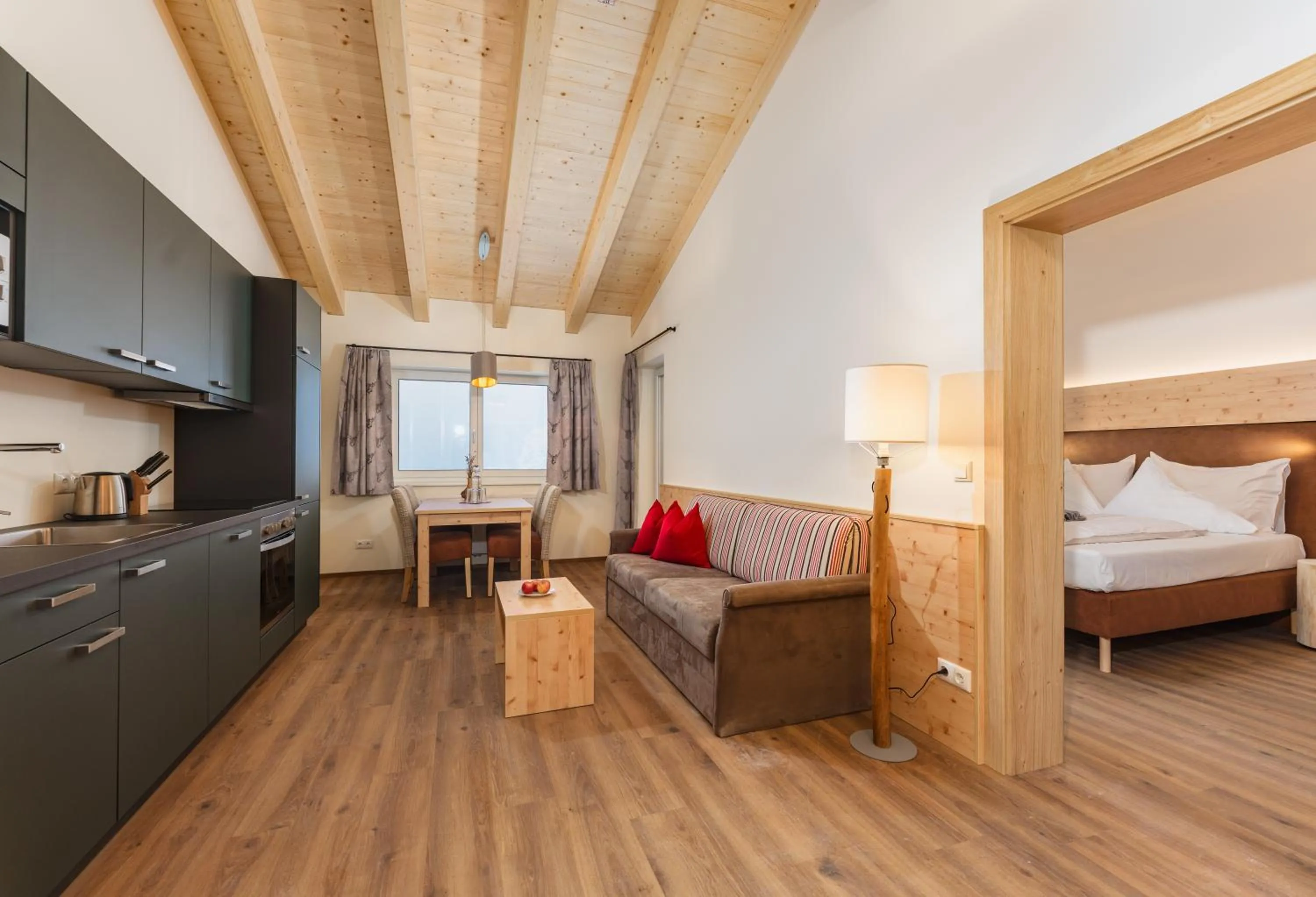 Living room, Bed in Berghotel Jaga-Alm