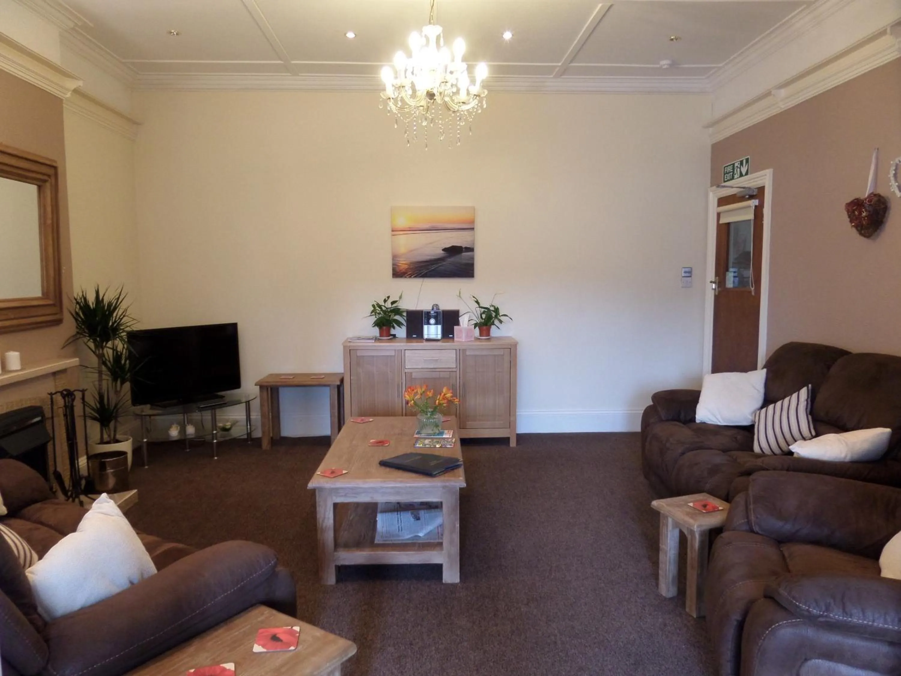 Communal lounge/ TV room in Beecroft Lodge
