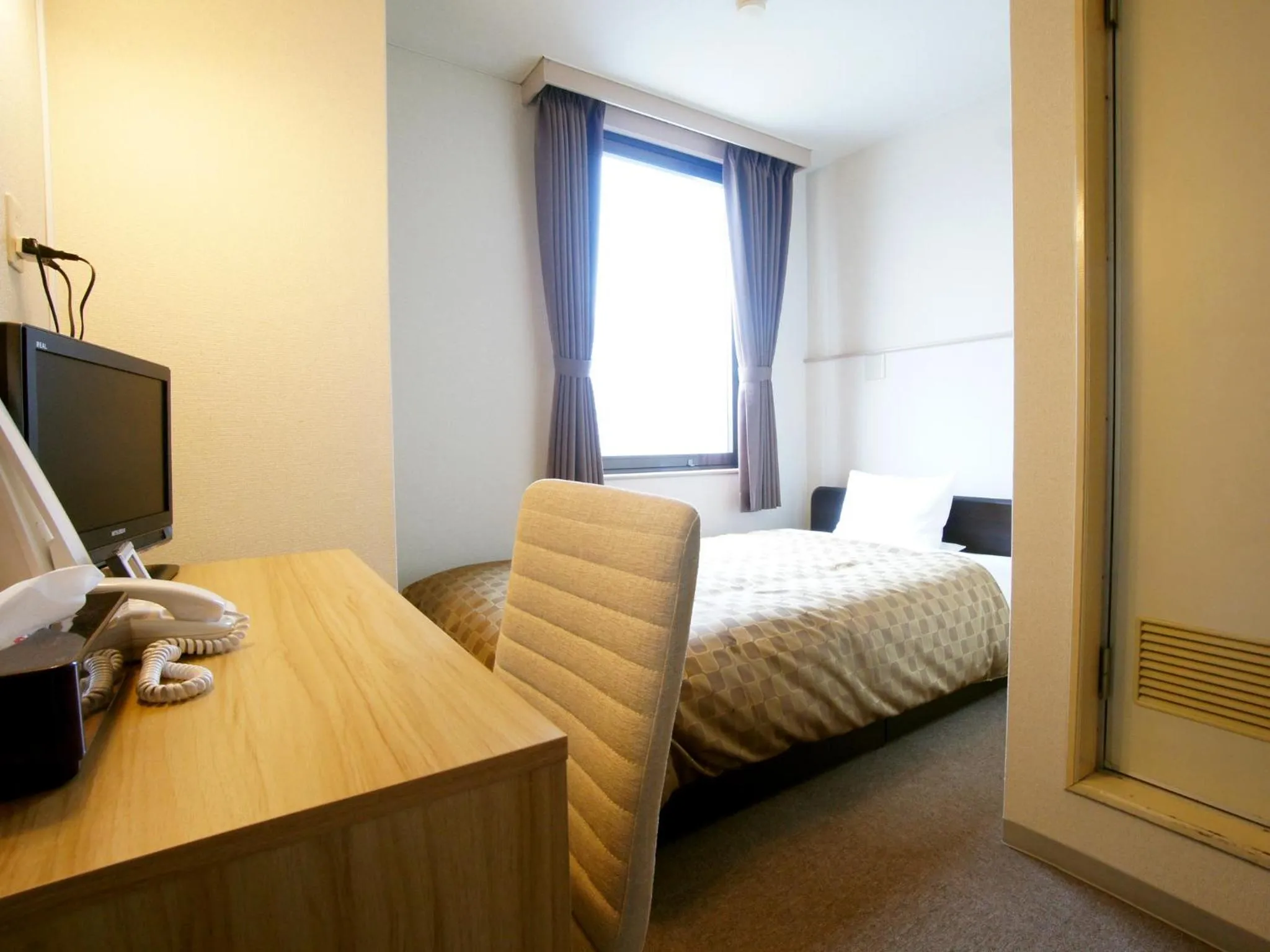 Photo of the whole room, Bed in Hotel Trend Iwakuni