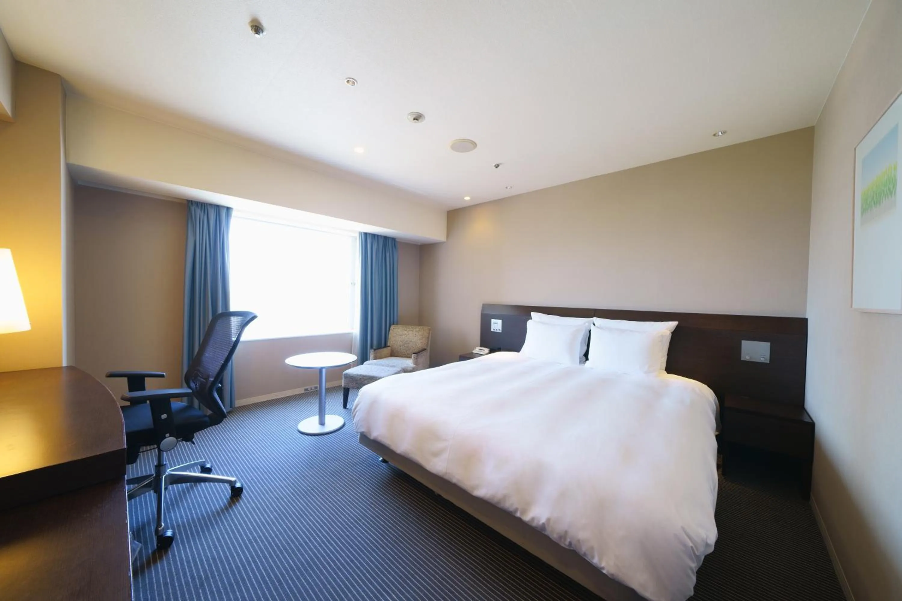 Bed in ANA Crowne Plaza Hiroshima by IHG
