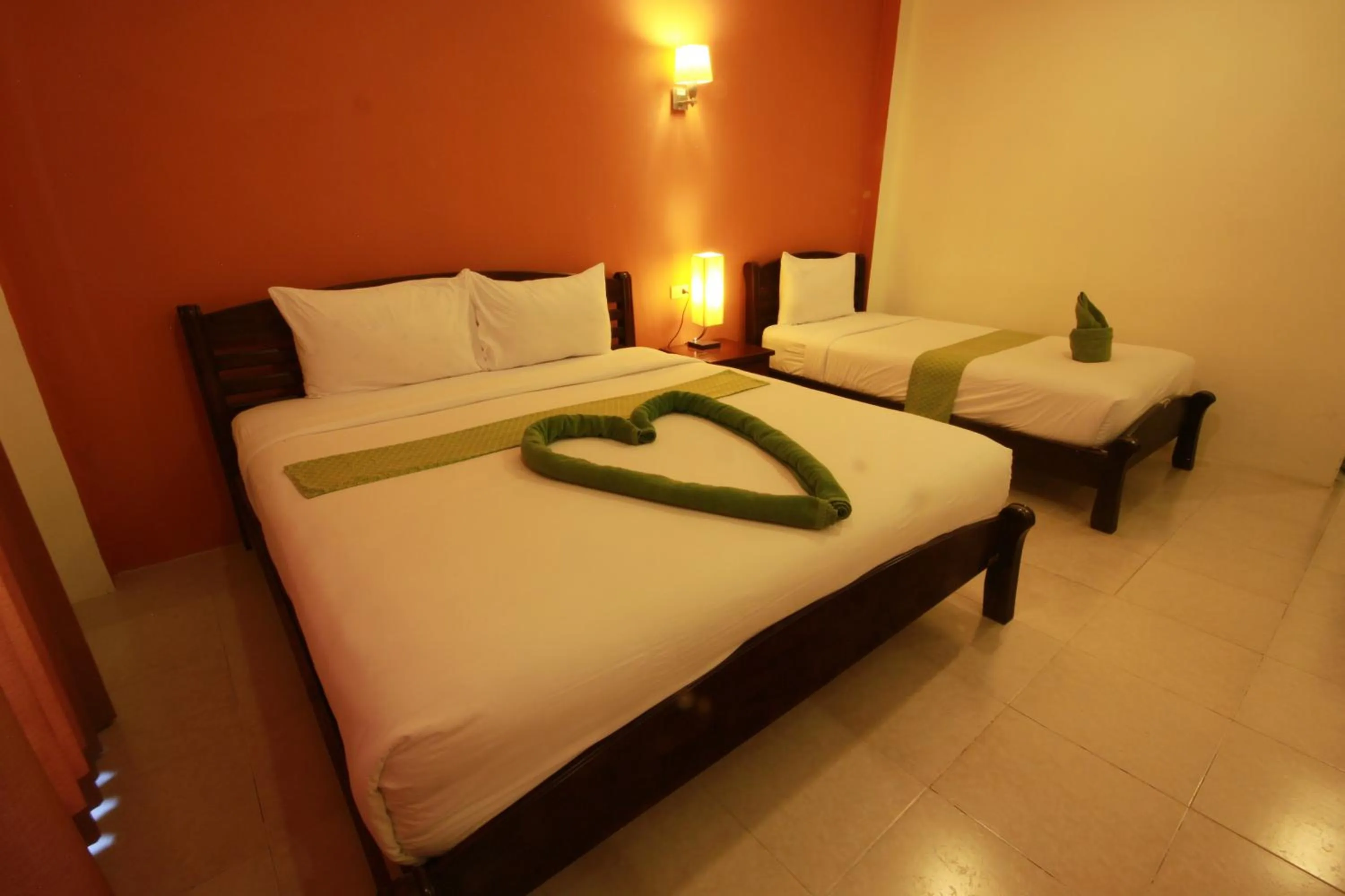 Bed in Tharathip Resort Koh Phangan - SHA Plus