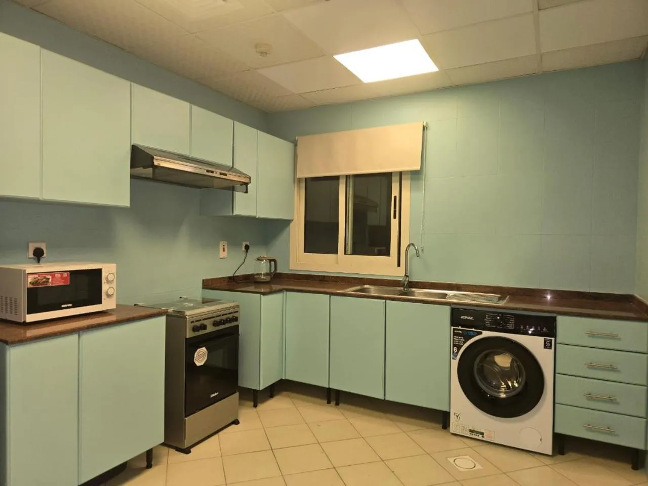 Kitchen or kitchenette in Al Raya Hotel Apartments