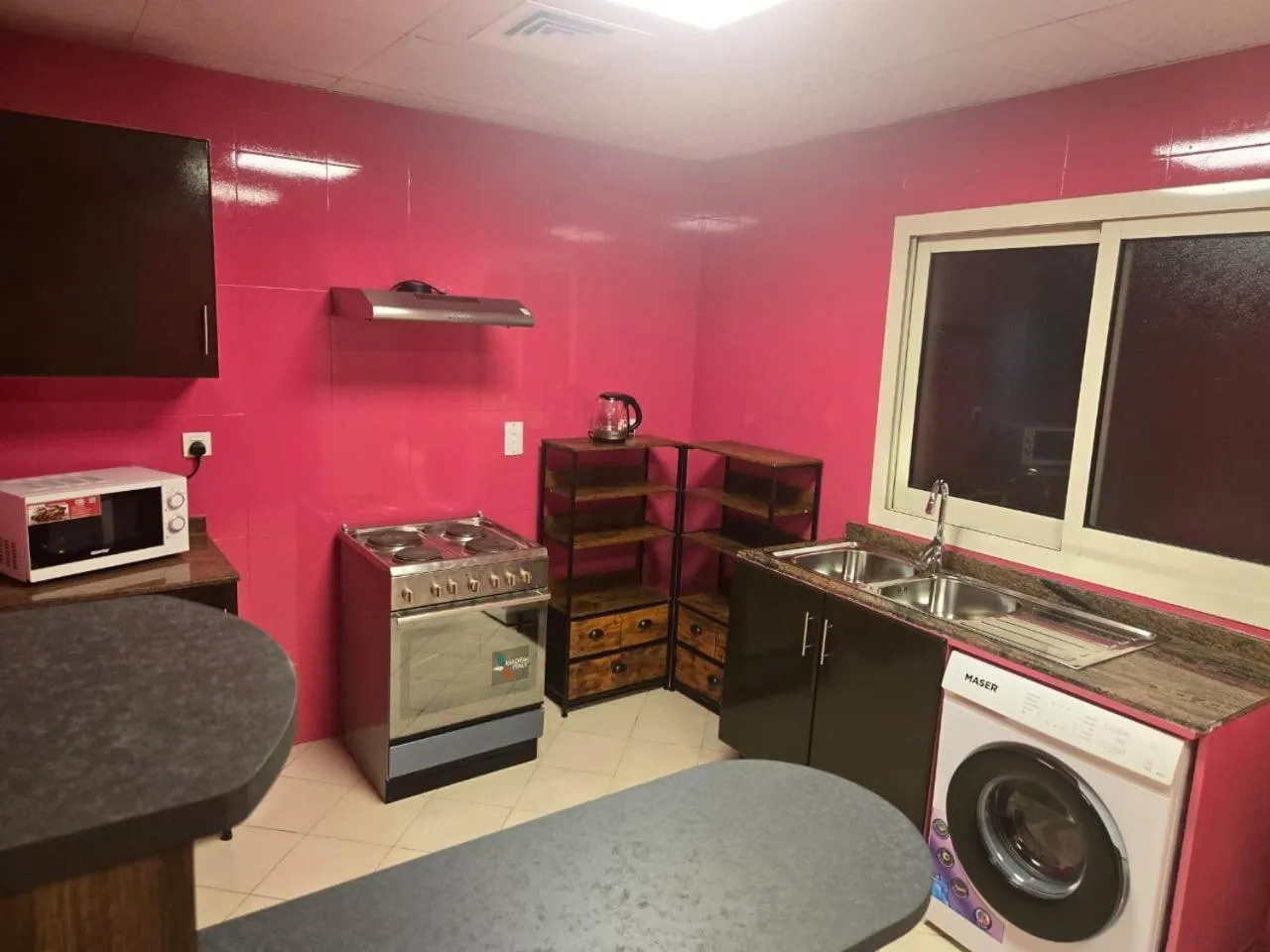 Kitchen or kitchenette in Al Raya Hotel Apartments