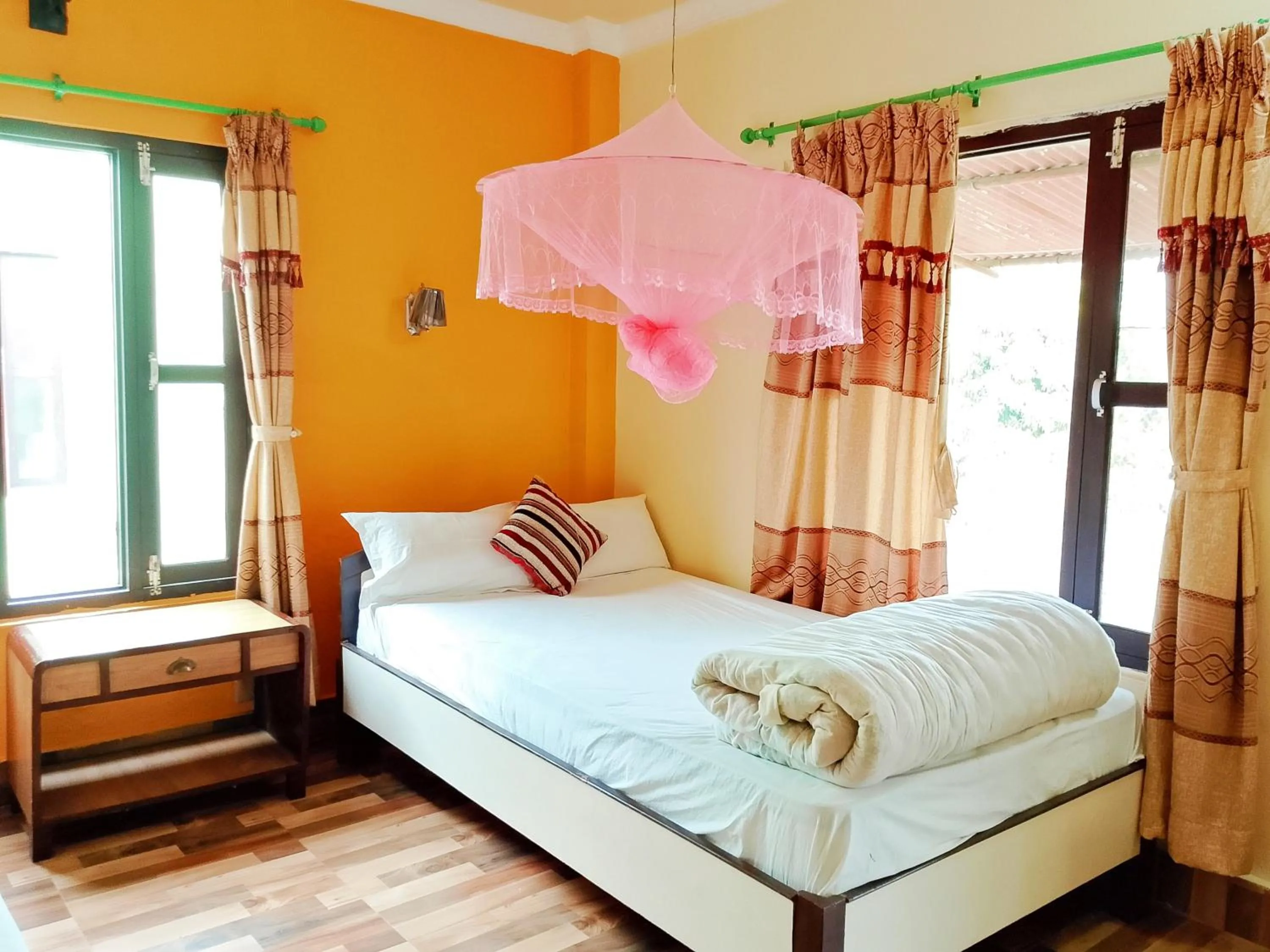 Patio, Bed in Hotel Rhino Land-Sauraha Family Home
