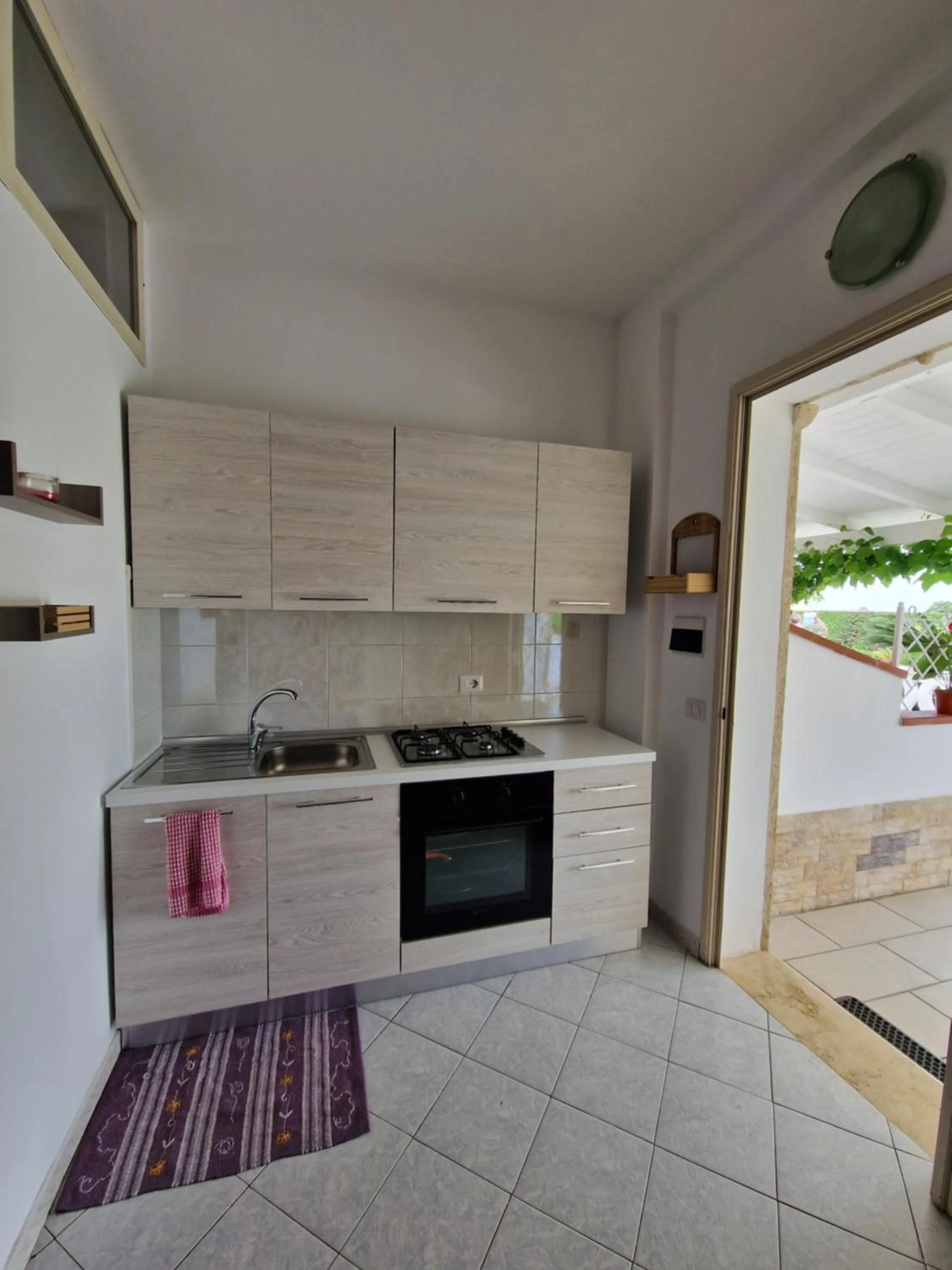 Kitchen or kitchenette in SANTA VENERE Apartments "PARCHEGGIO interno MOTO-AUTO" Ricarica auto Elettriche