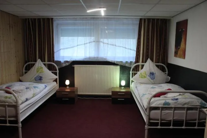Photo of the whole room, Bed in Waldpension Pfeiferhaus