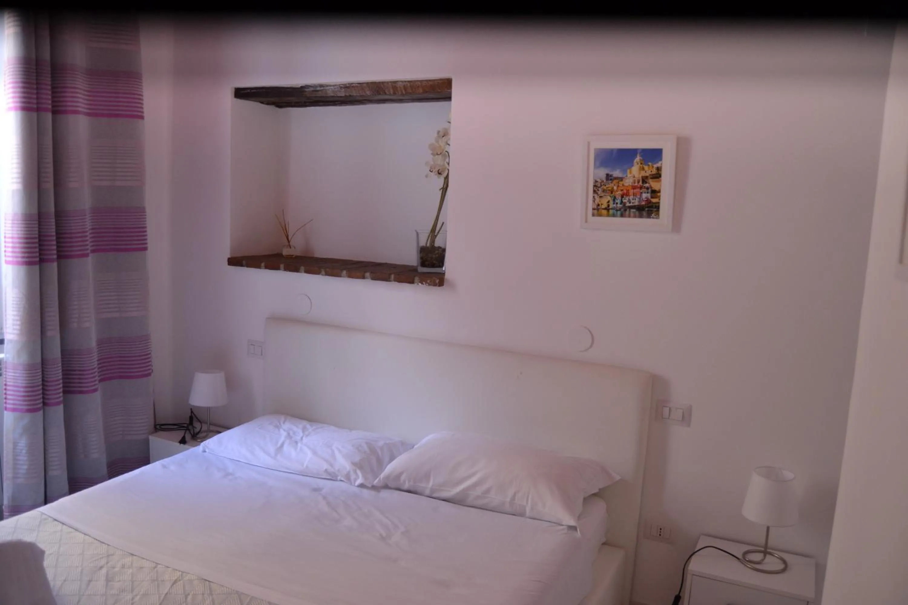 Bed in Il Borghetto Apartments & Rooms