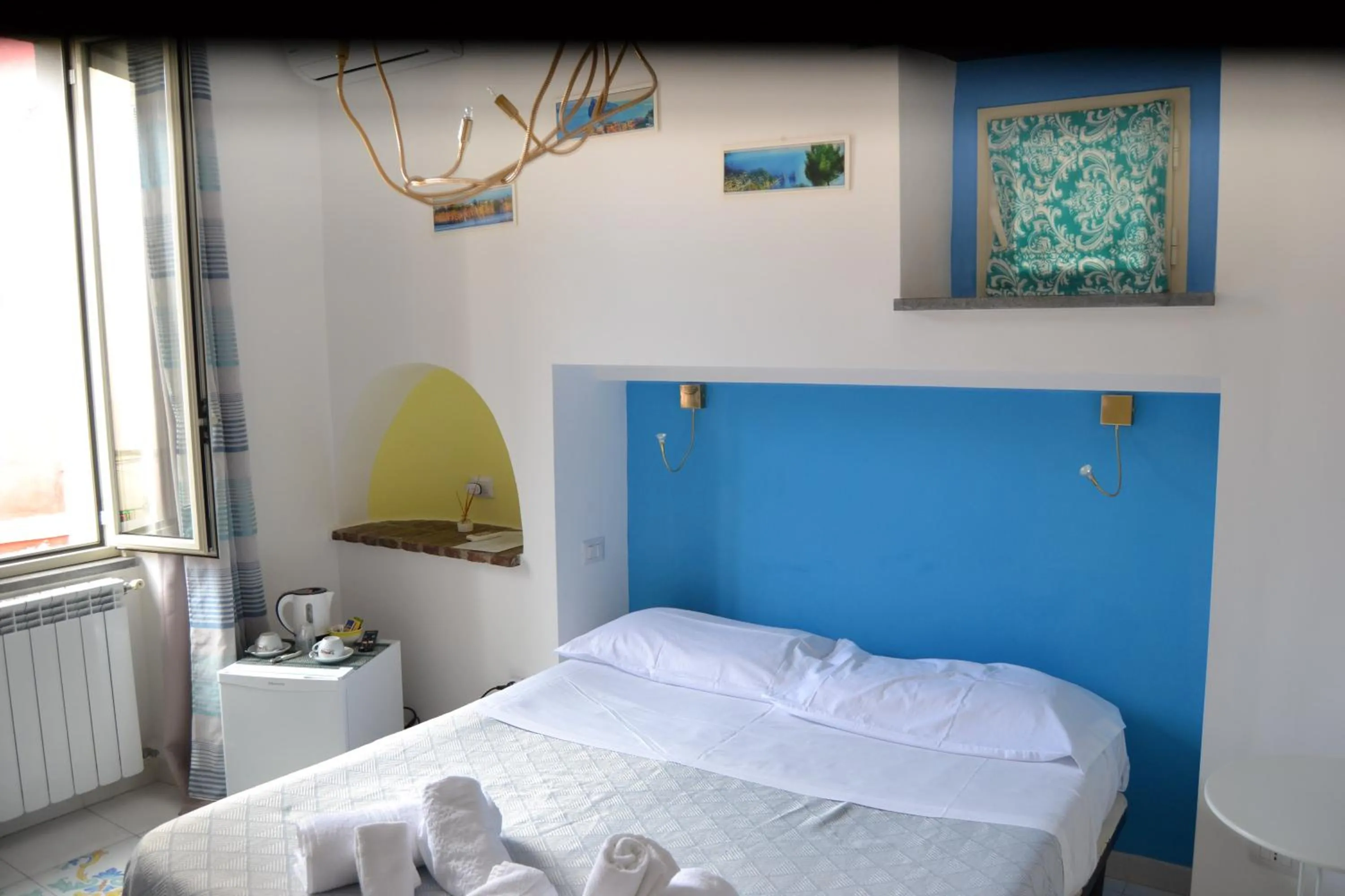 Bed in Il Borghetto Apartments & Rooms