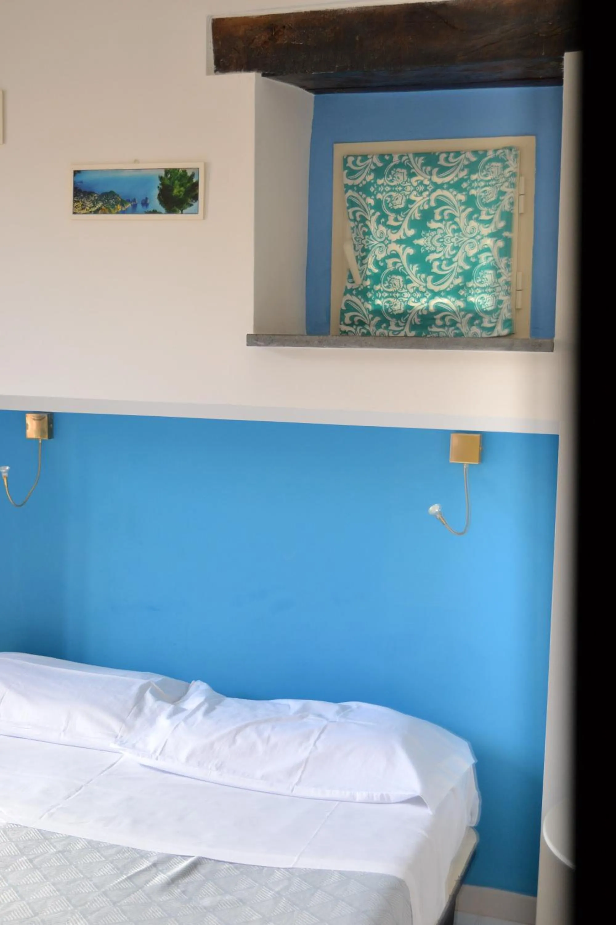 Bed in Il Borghetto Apartments & Rooms