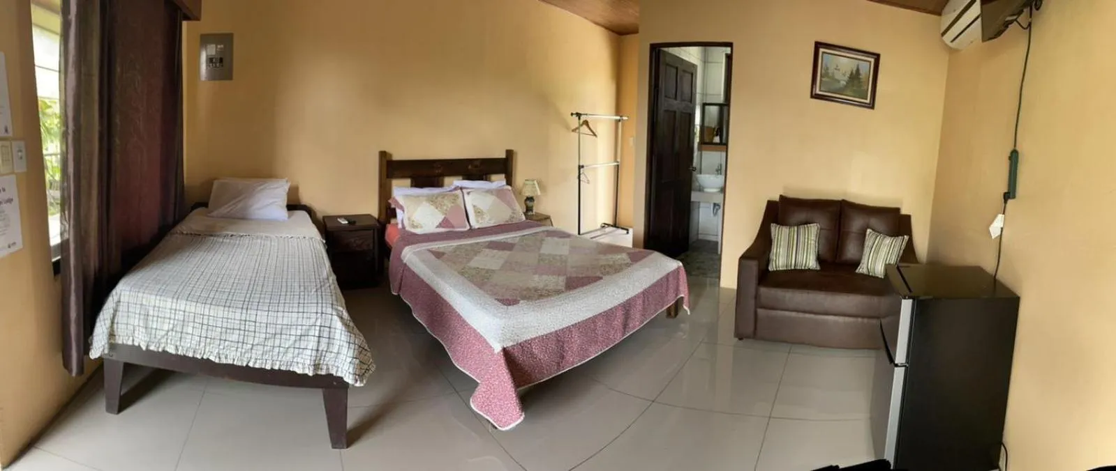 Bed in Aunty Arenal Lodge