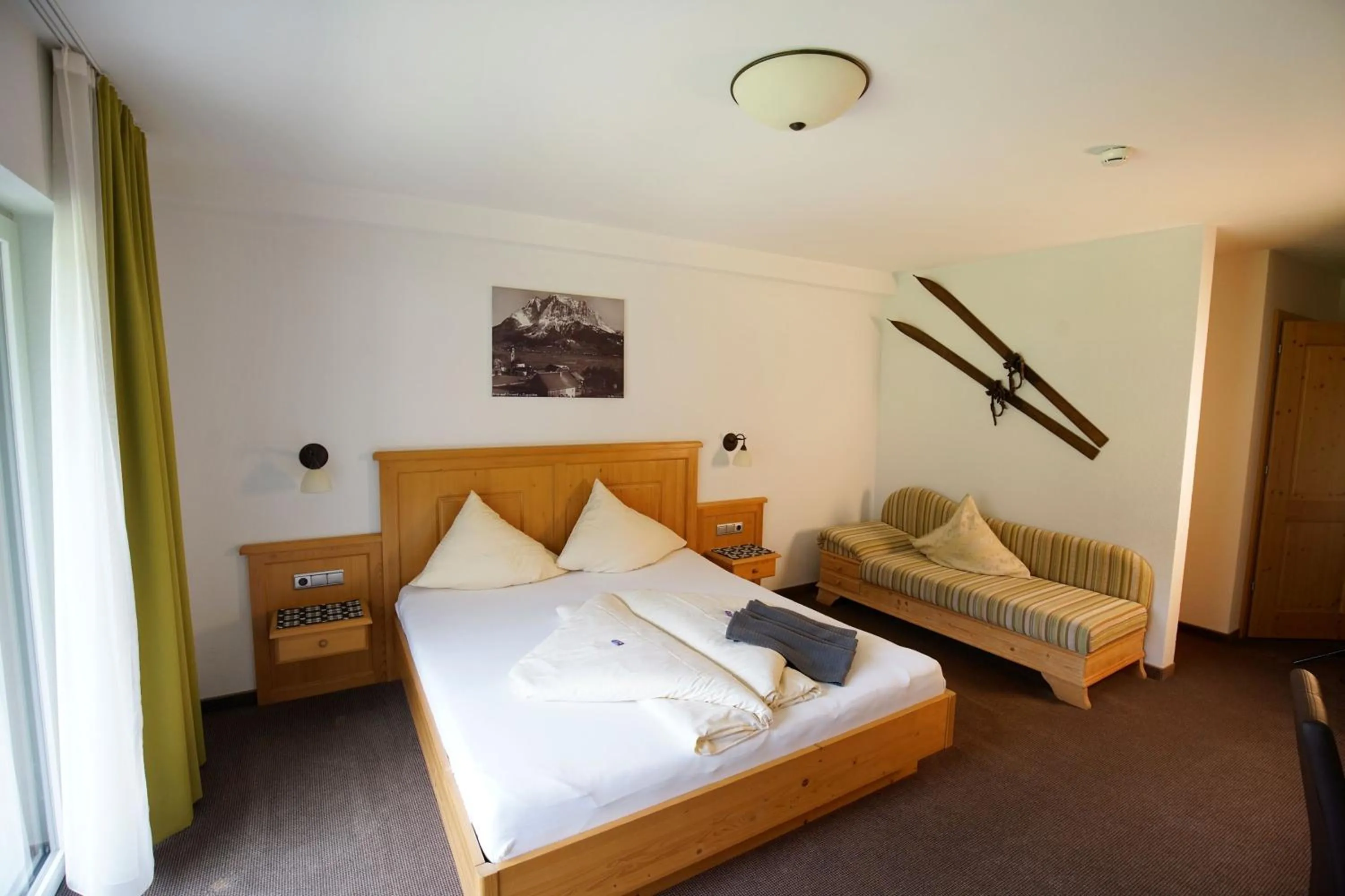 Bedroom, Bed in Alpenstern rooms & suites