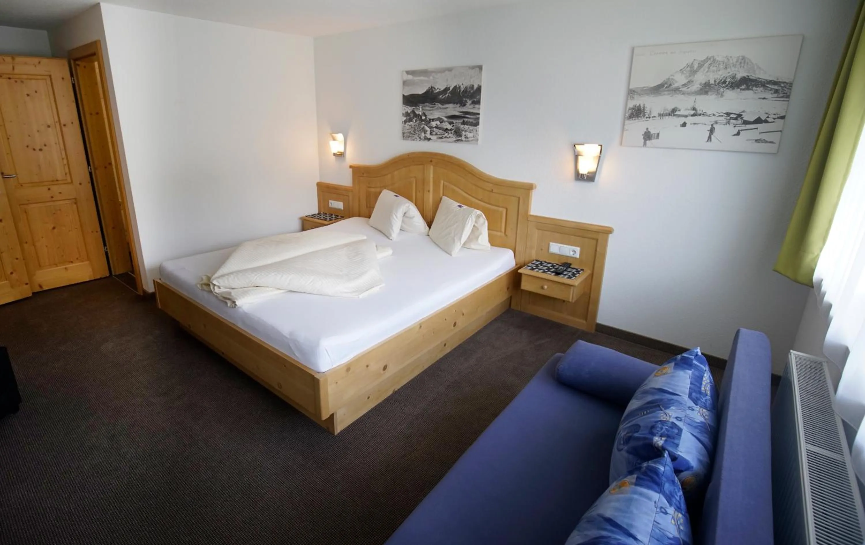 Bed in Alpenstern rooms & suites