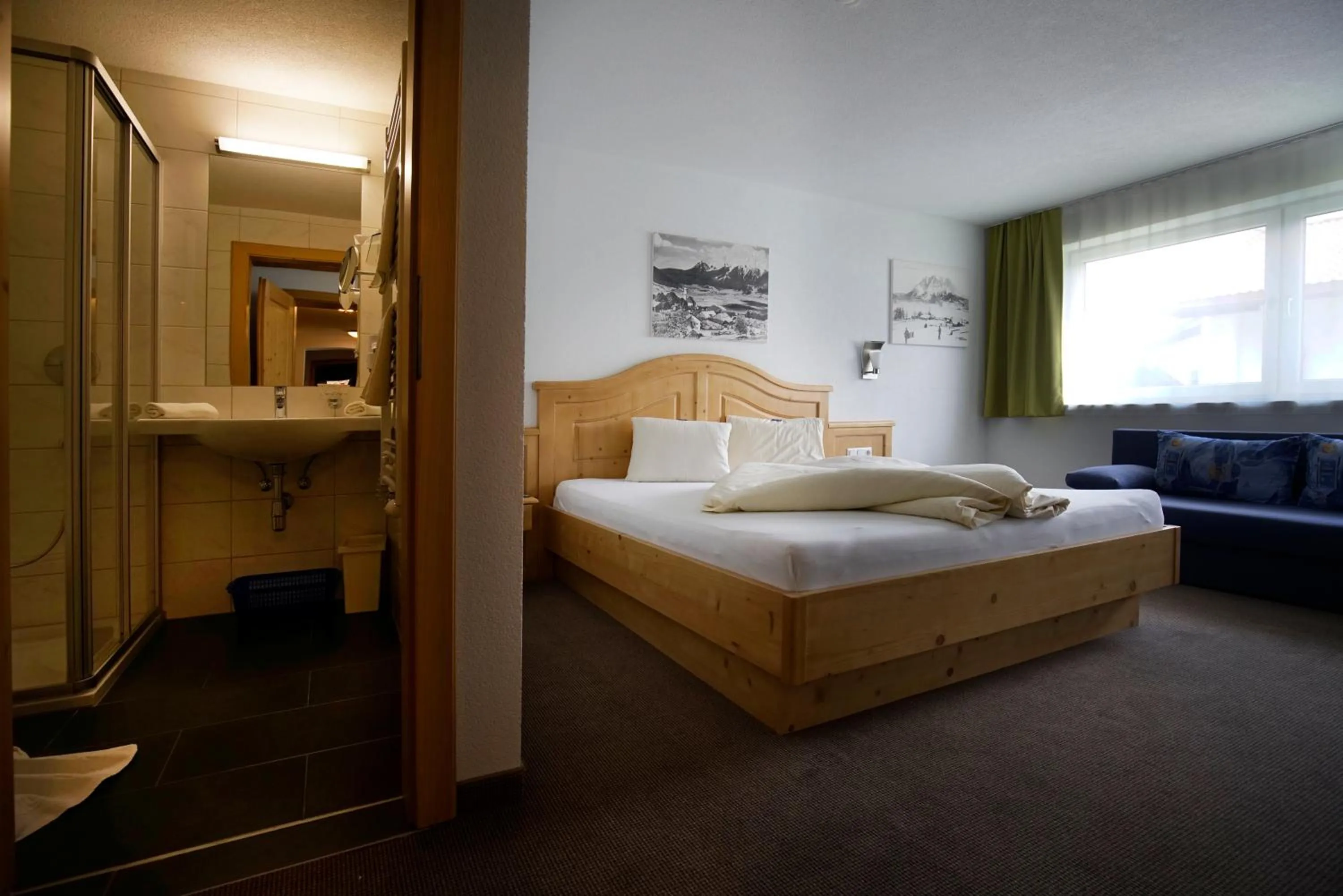Bed in Alpenstern rooms & suites