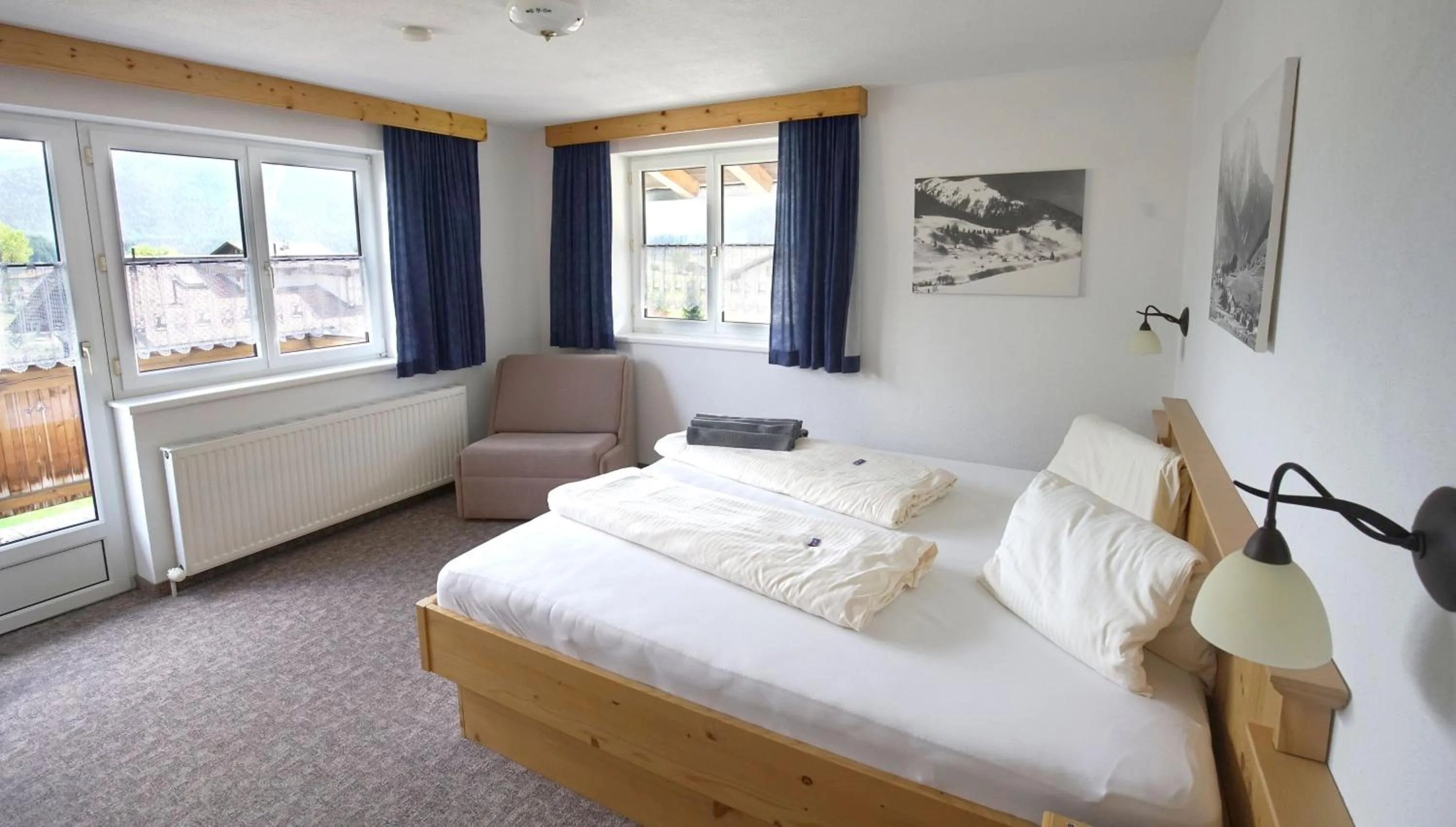 Bed in Alpenstern rooms & suites
