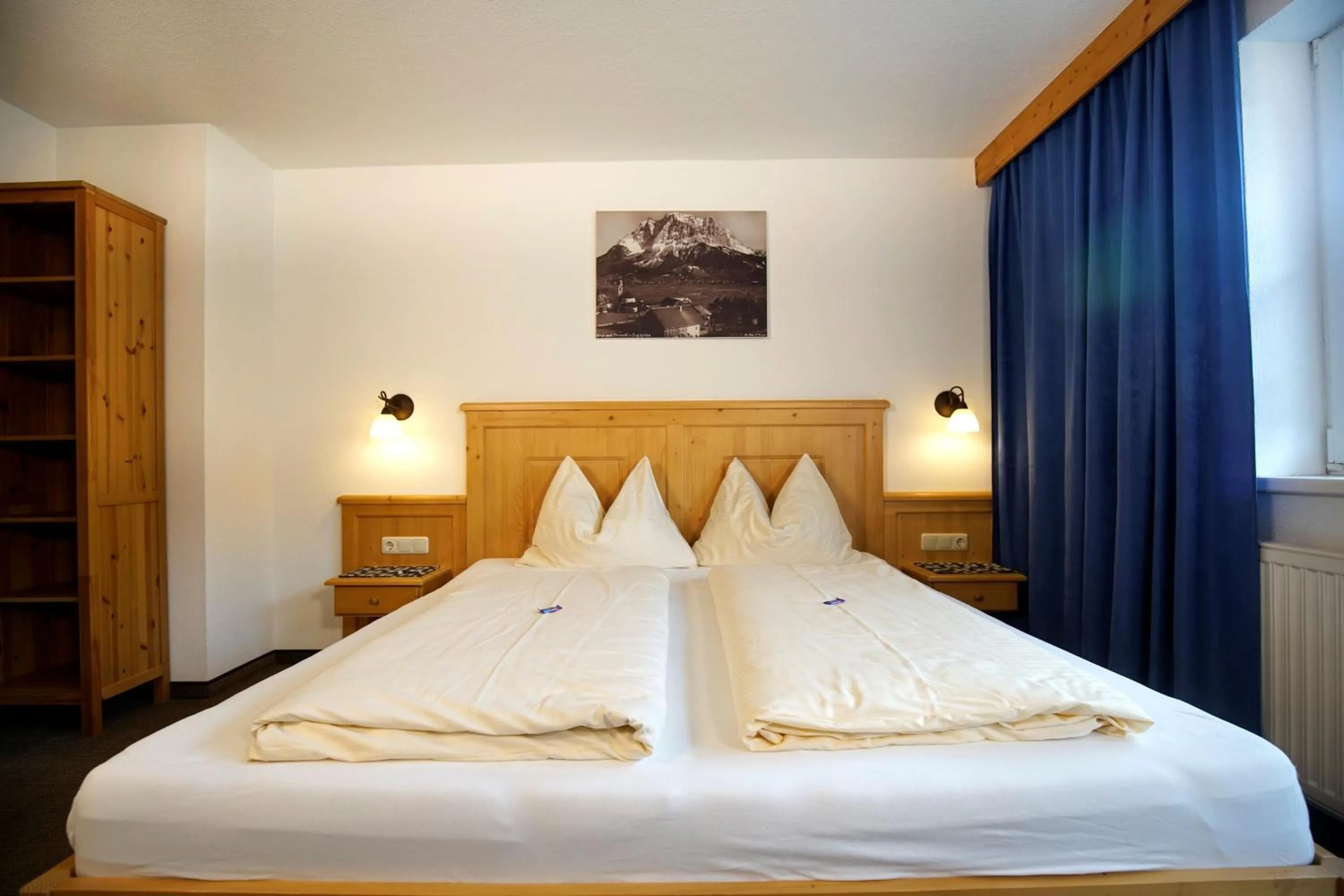 Bedroom, Bed in Alpenstern rooms & suites