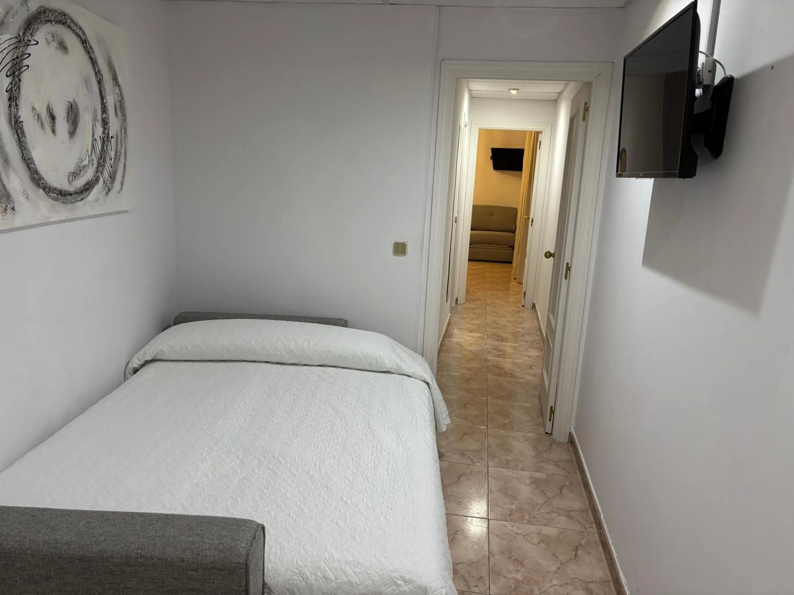 Communal lounge/ TV room, Bed in Hotel Praderón