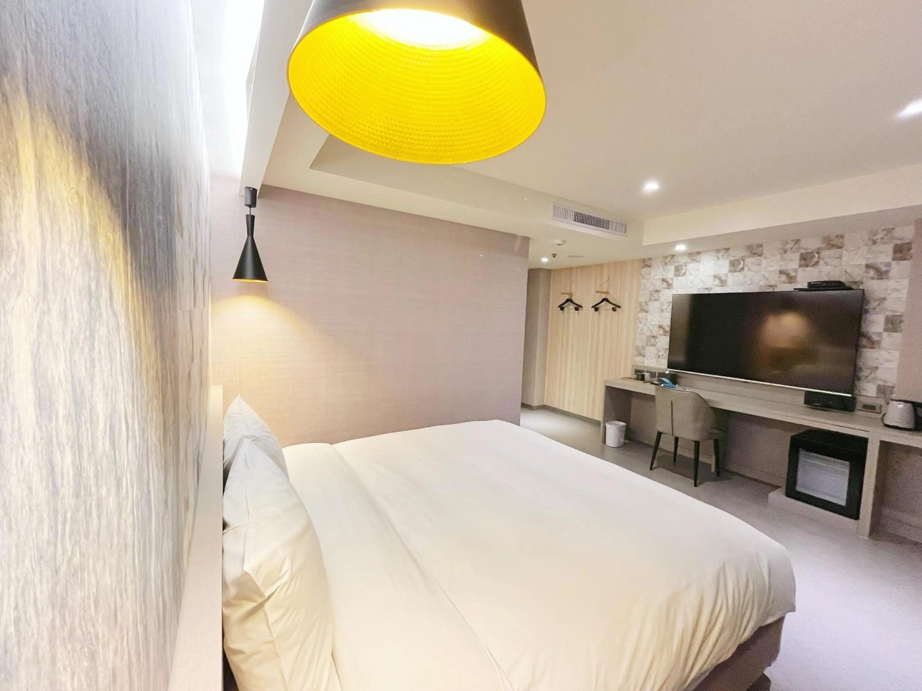 Bed in 新仕飯店-New City Hotel