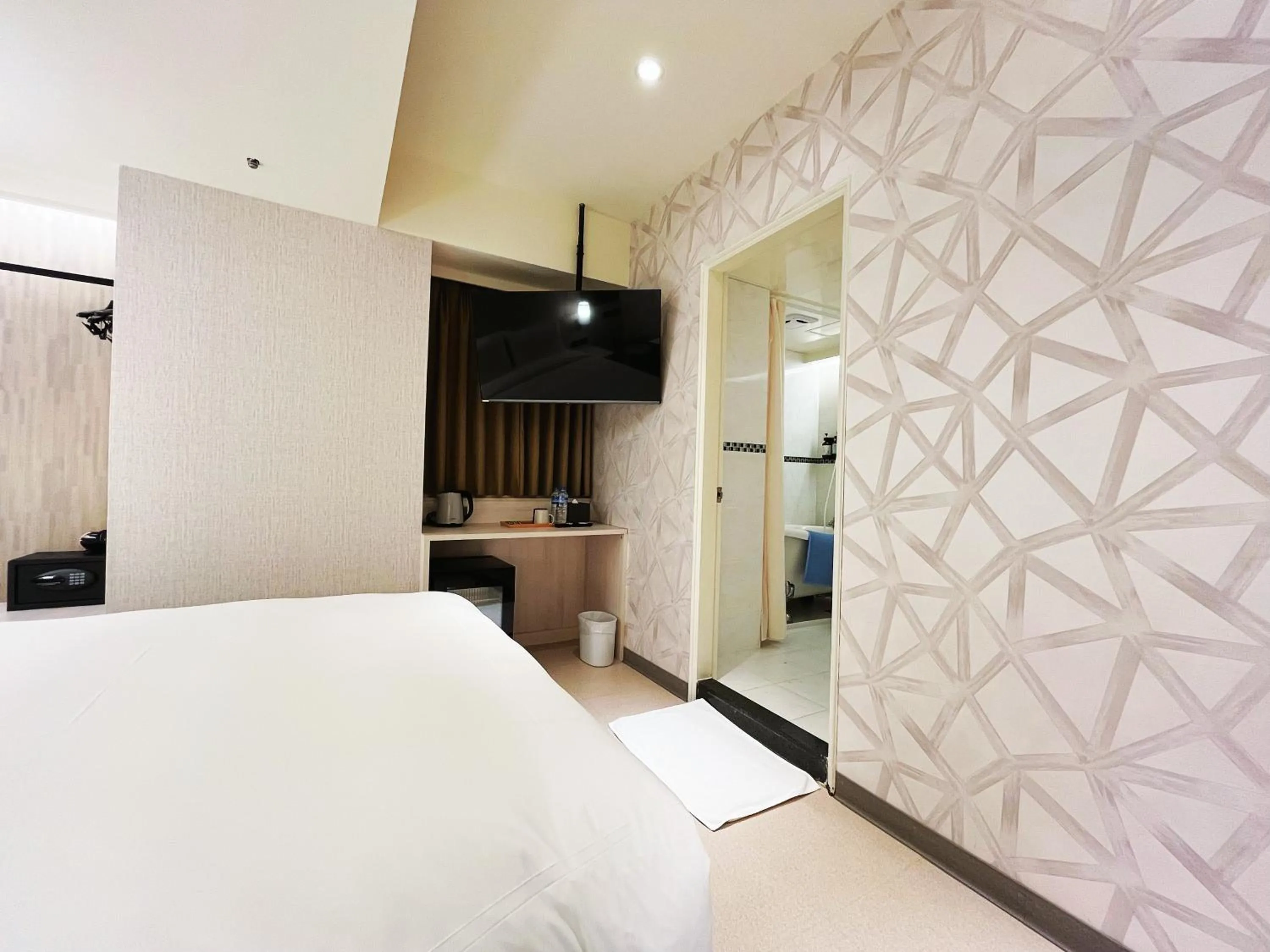 Bed in 新仕飯店-New City Hotel