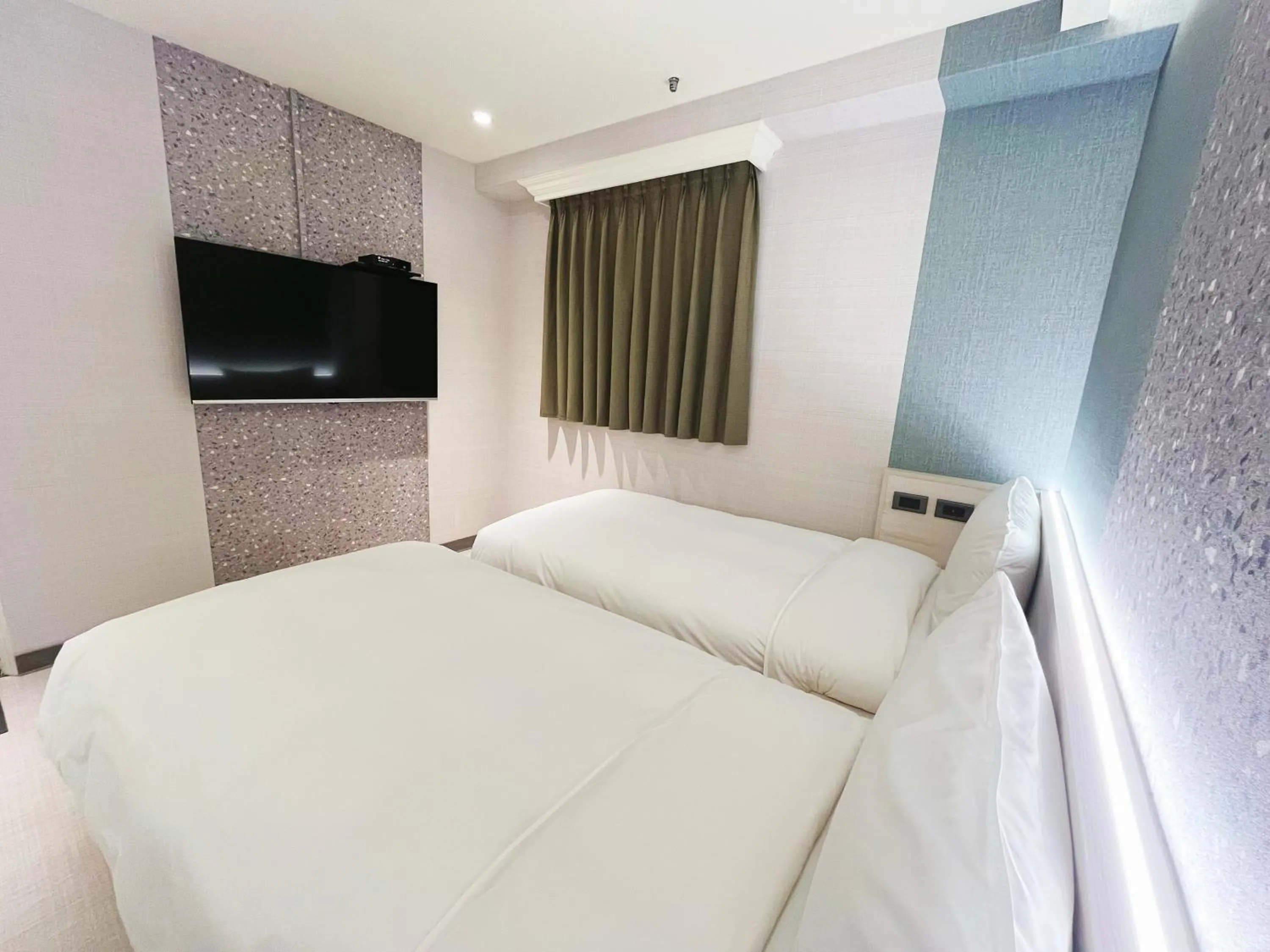 Bed in 新仕飯店-New City Hotel