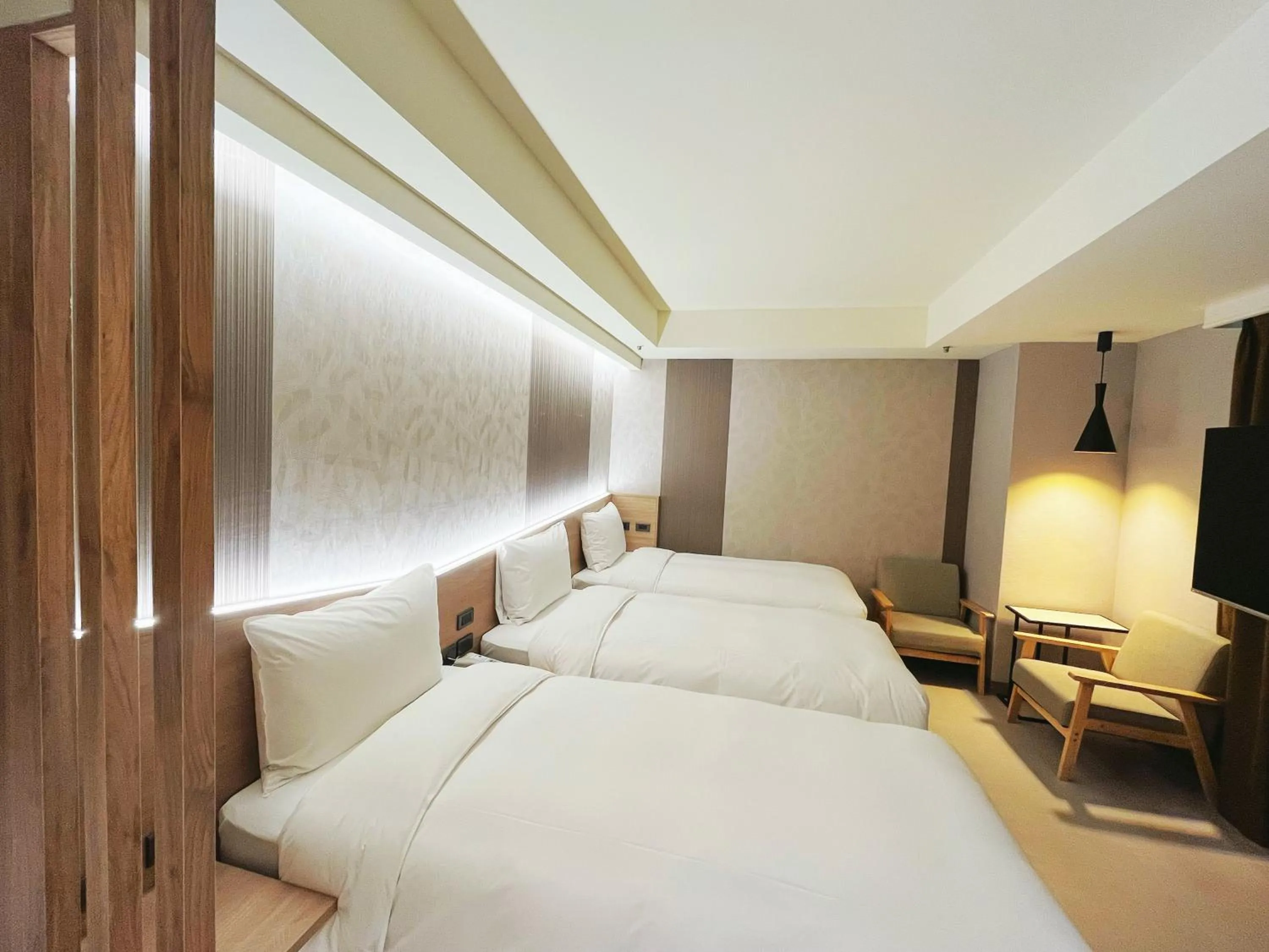 Bed in 新仕飯店-New City Hotel