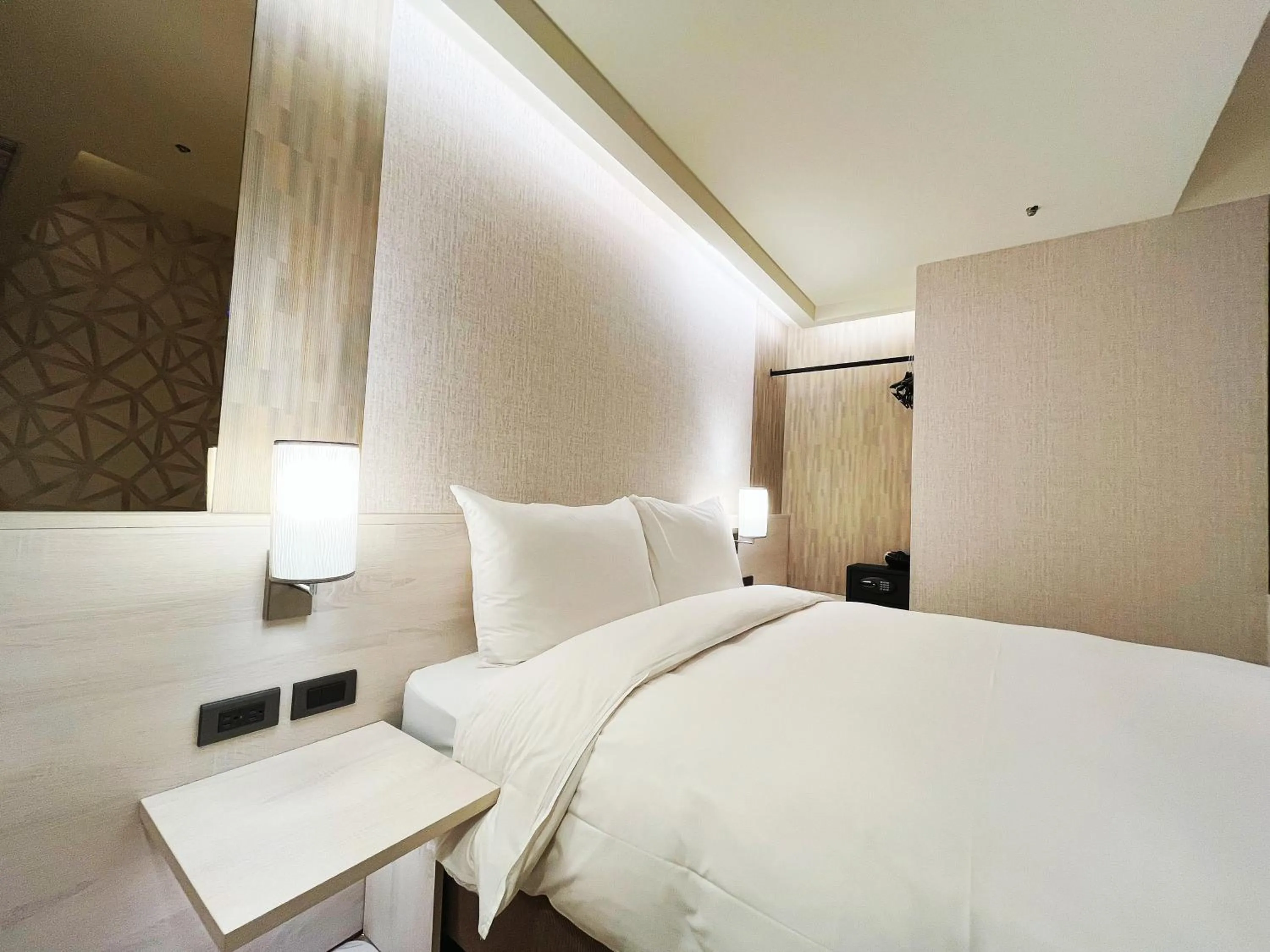 Bed in 新仕飯店-New City Hotel
