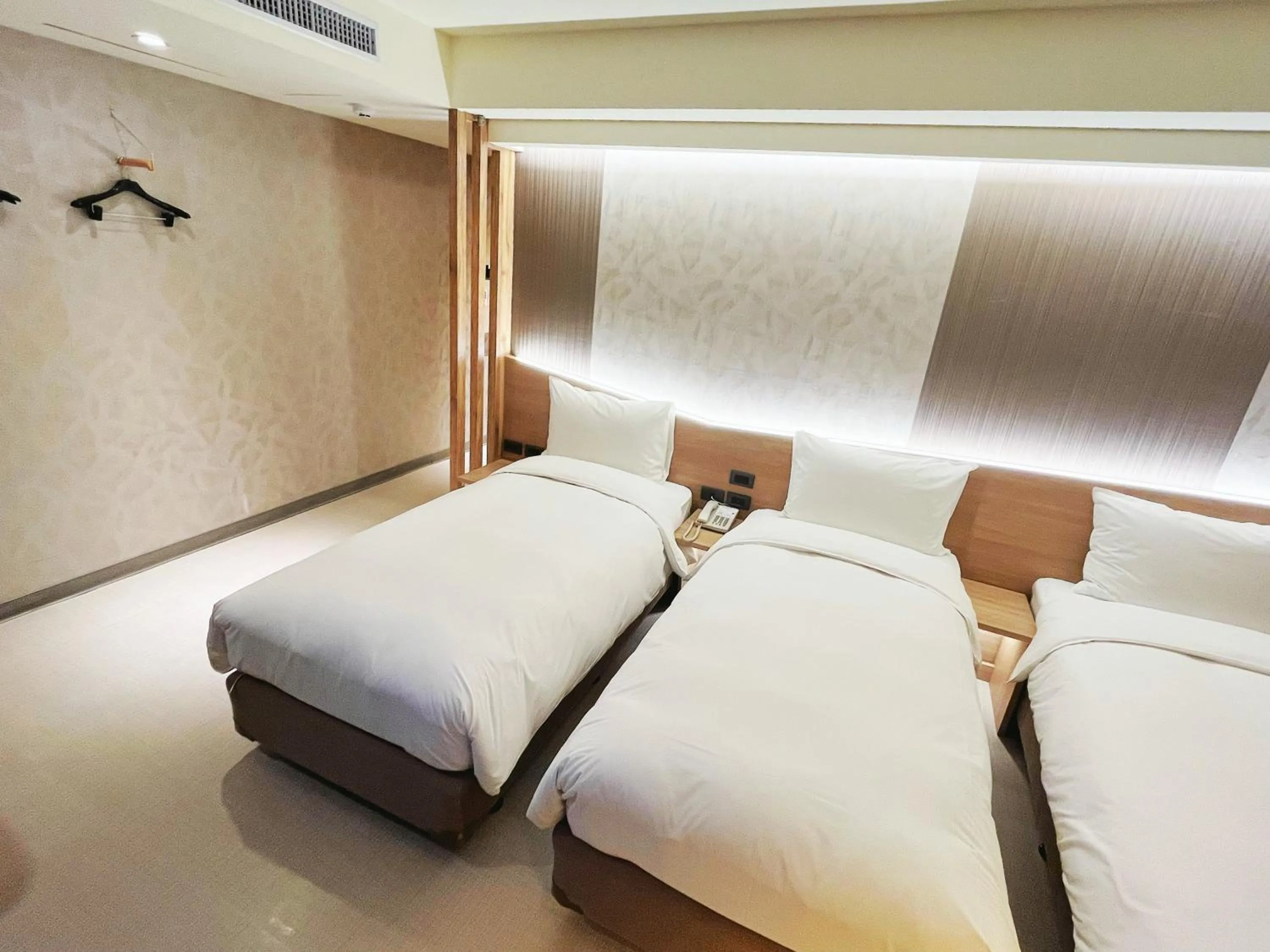 Bed in 新仕飯店-New City Hotel
