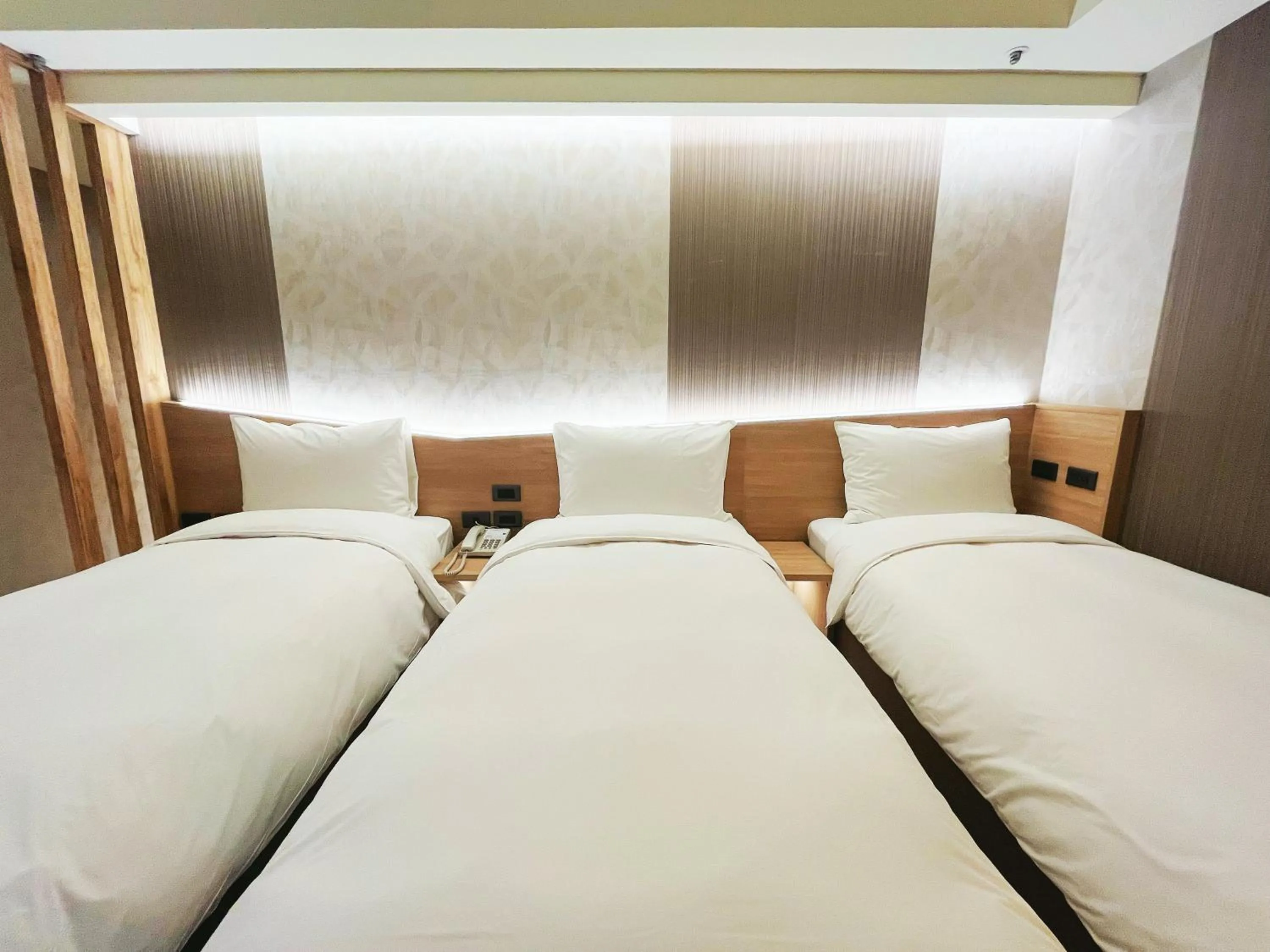 Bed in 新仕飯店-New City Hotel