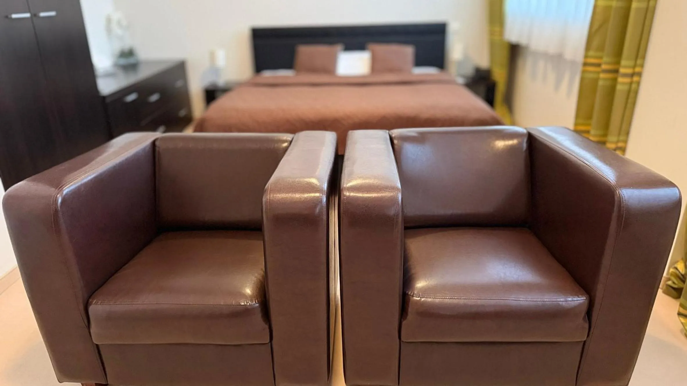 Seating area, Bed in Aston Hotel