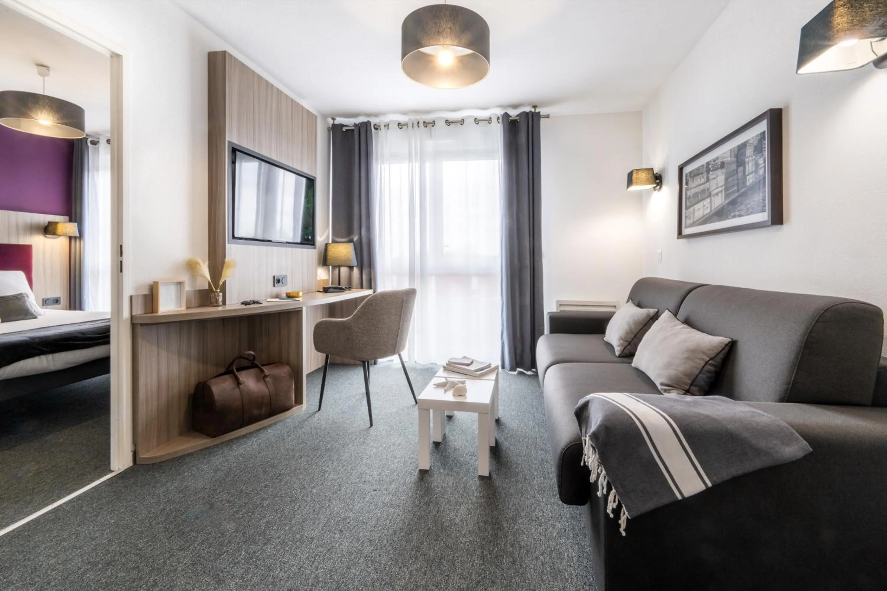 Seating area, Bed in Nemea Appart Hotel Stadium Bordeaux aéroport