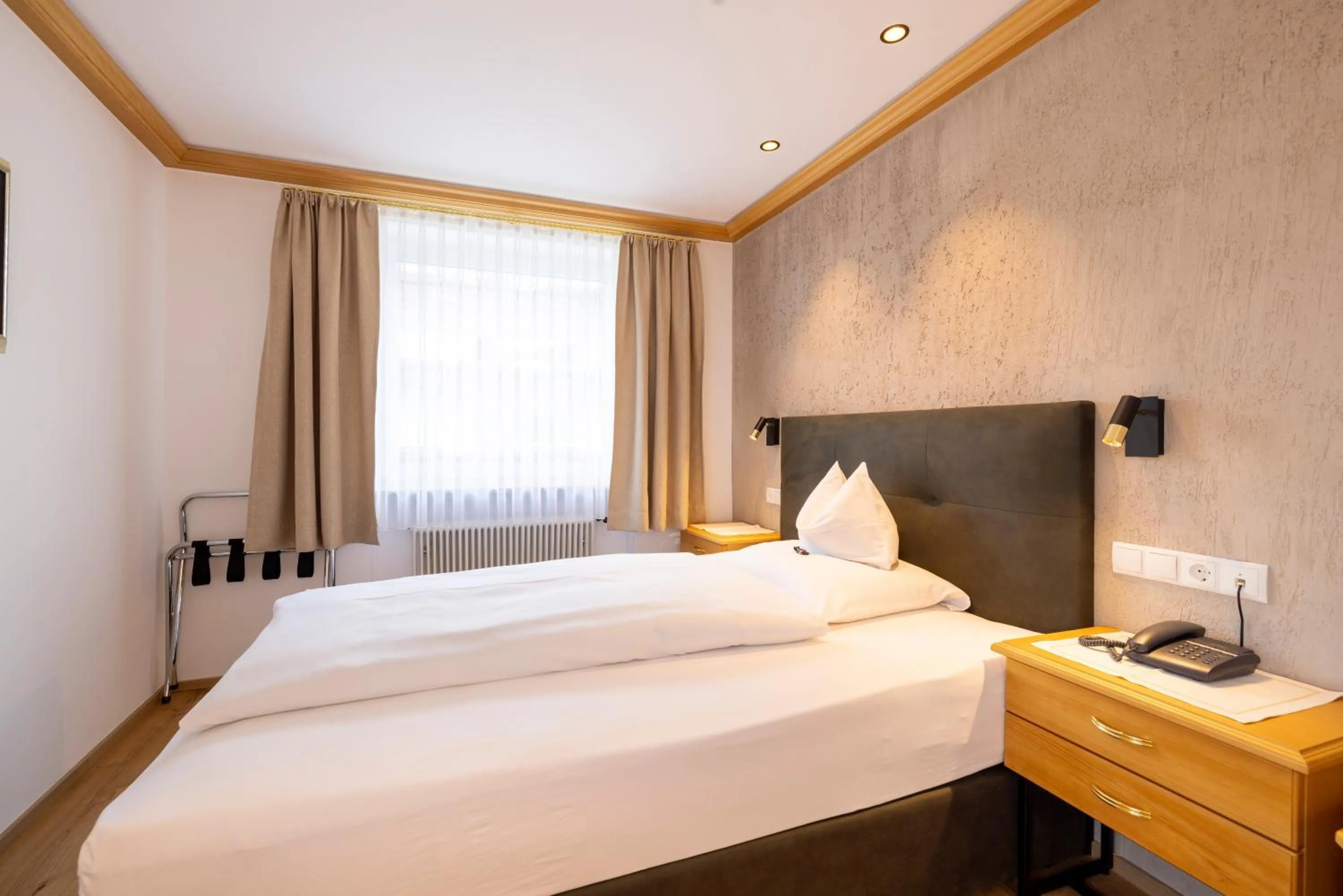 Photo of the whole room, Bed in Parkhotel Seefeld