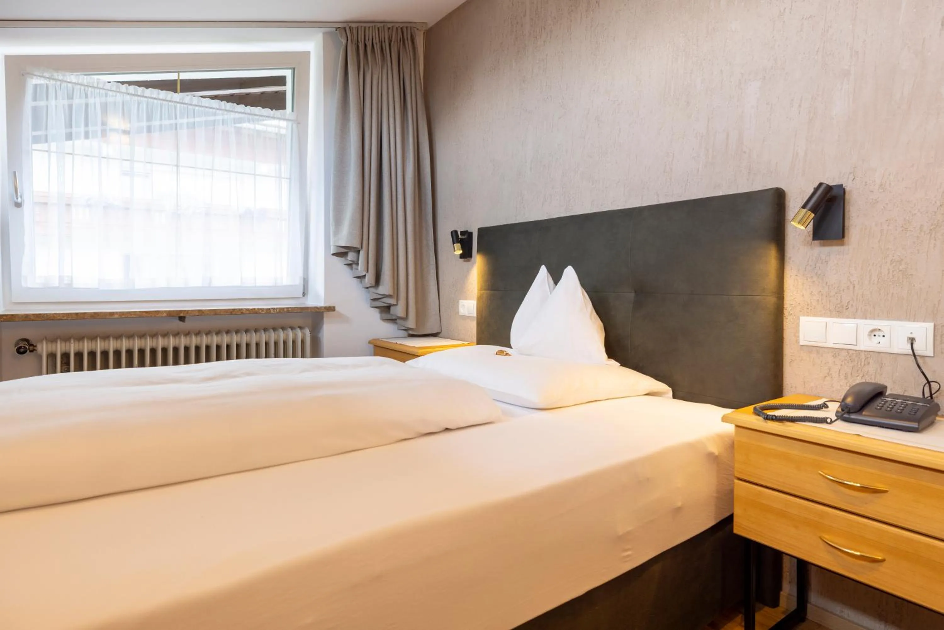 Photo of the whole room, Bed in Parkhotel Seefeld