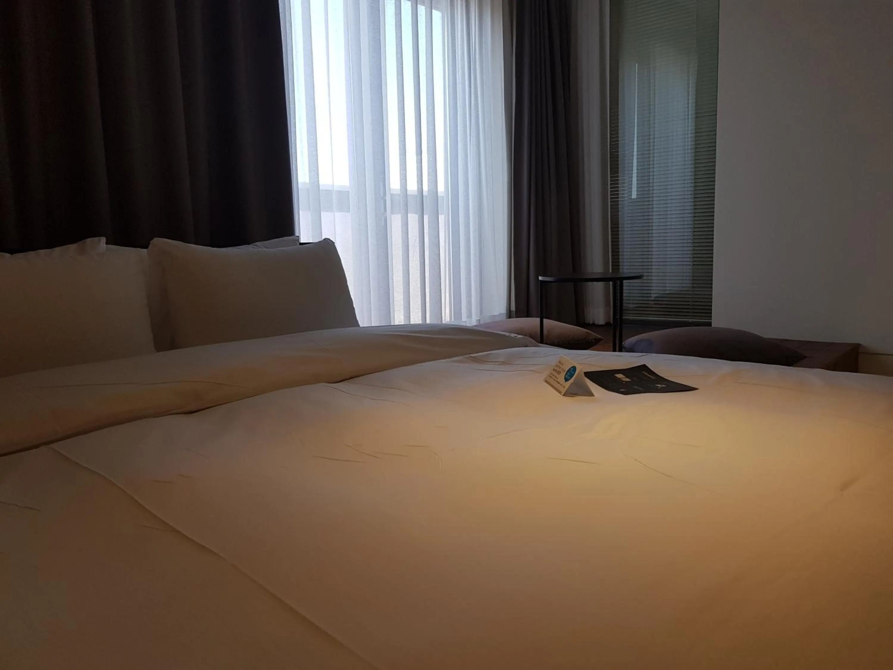 Bed in Rivertain Hotel