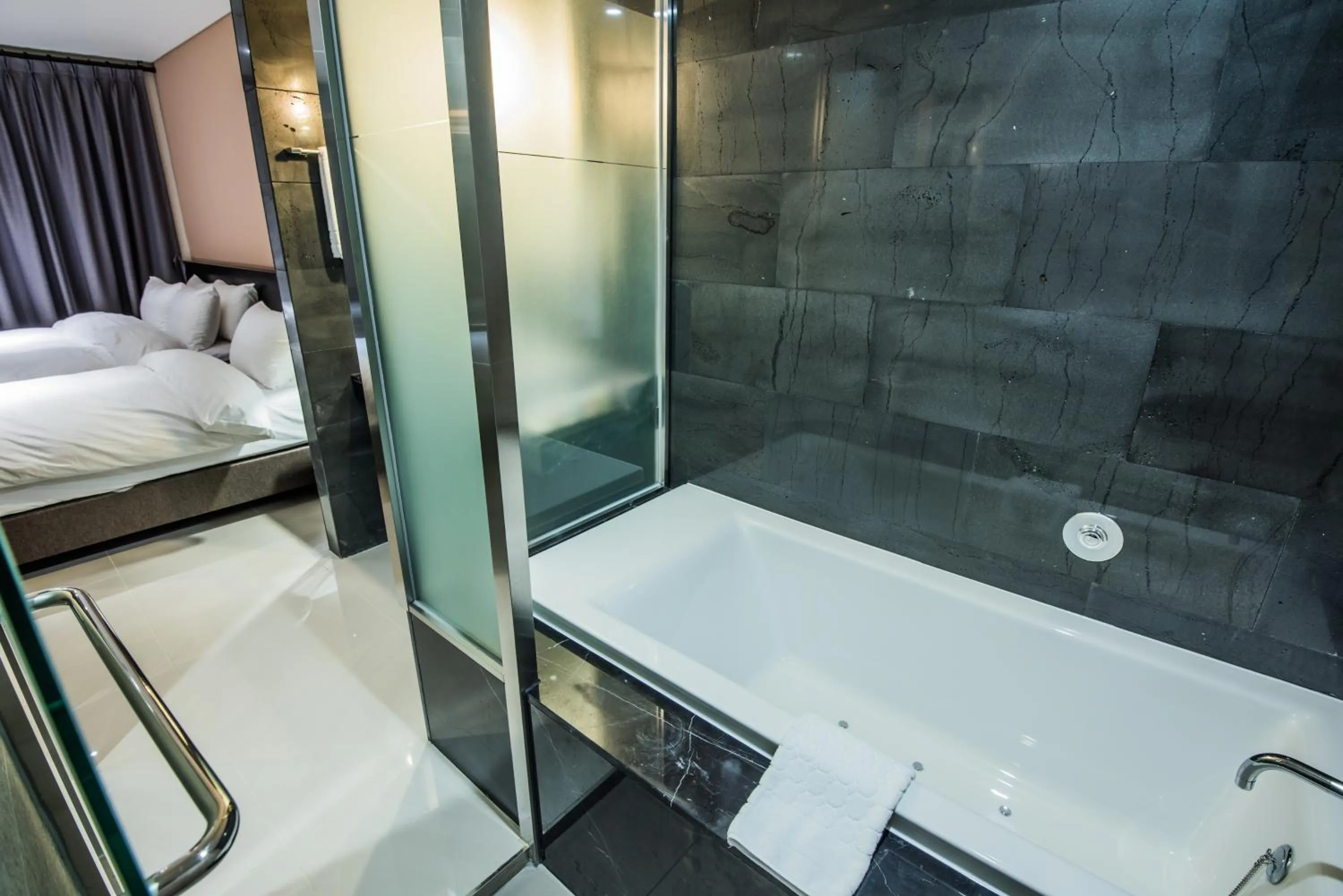 Bed in Rivertain Hotel