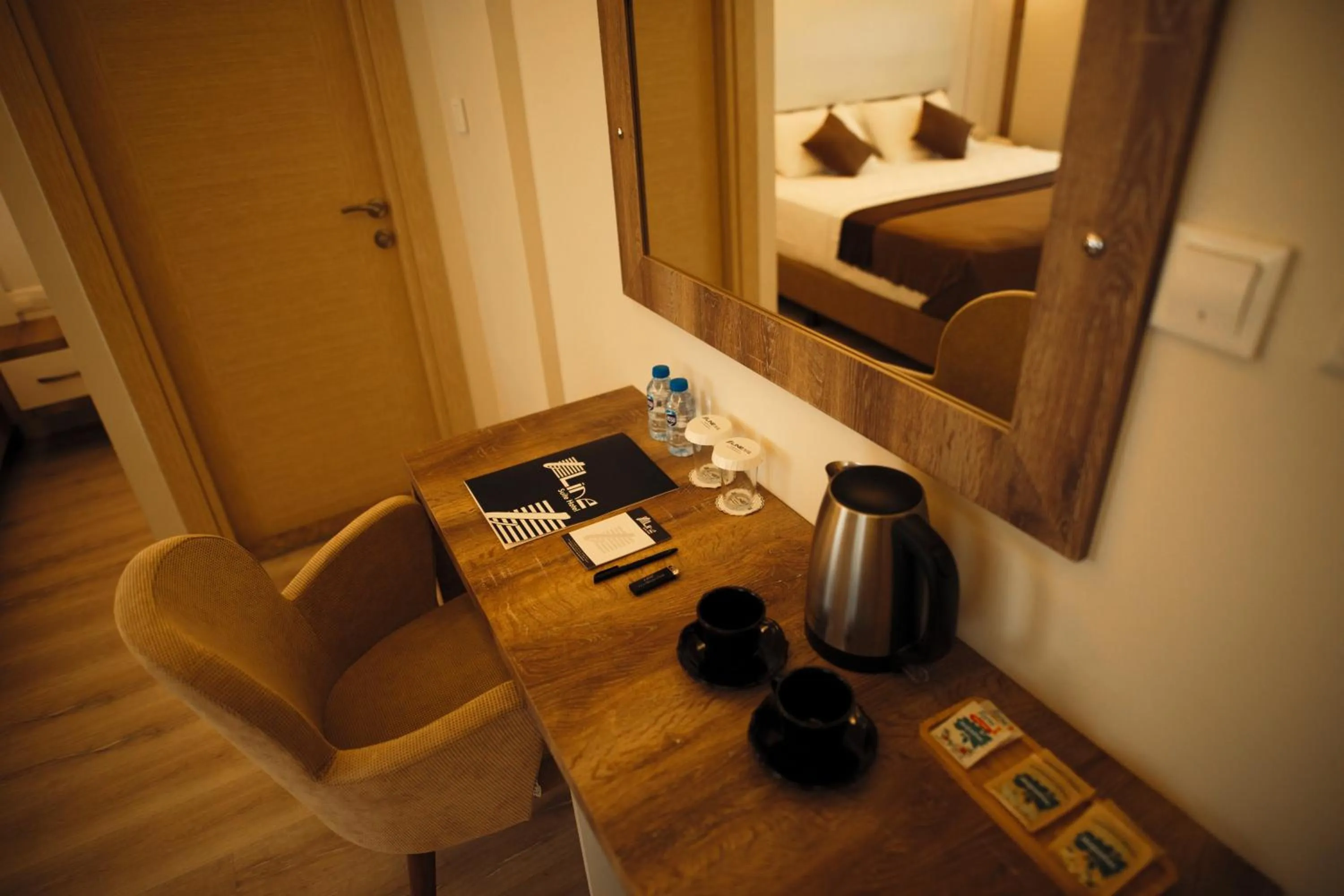 Coffee/tea facilities, Bed in Line Suite Hotel