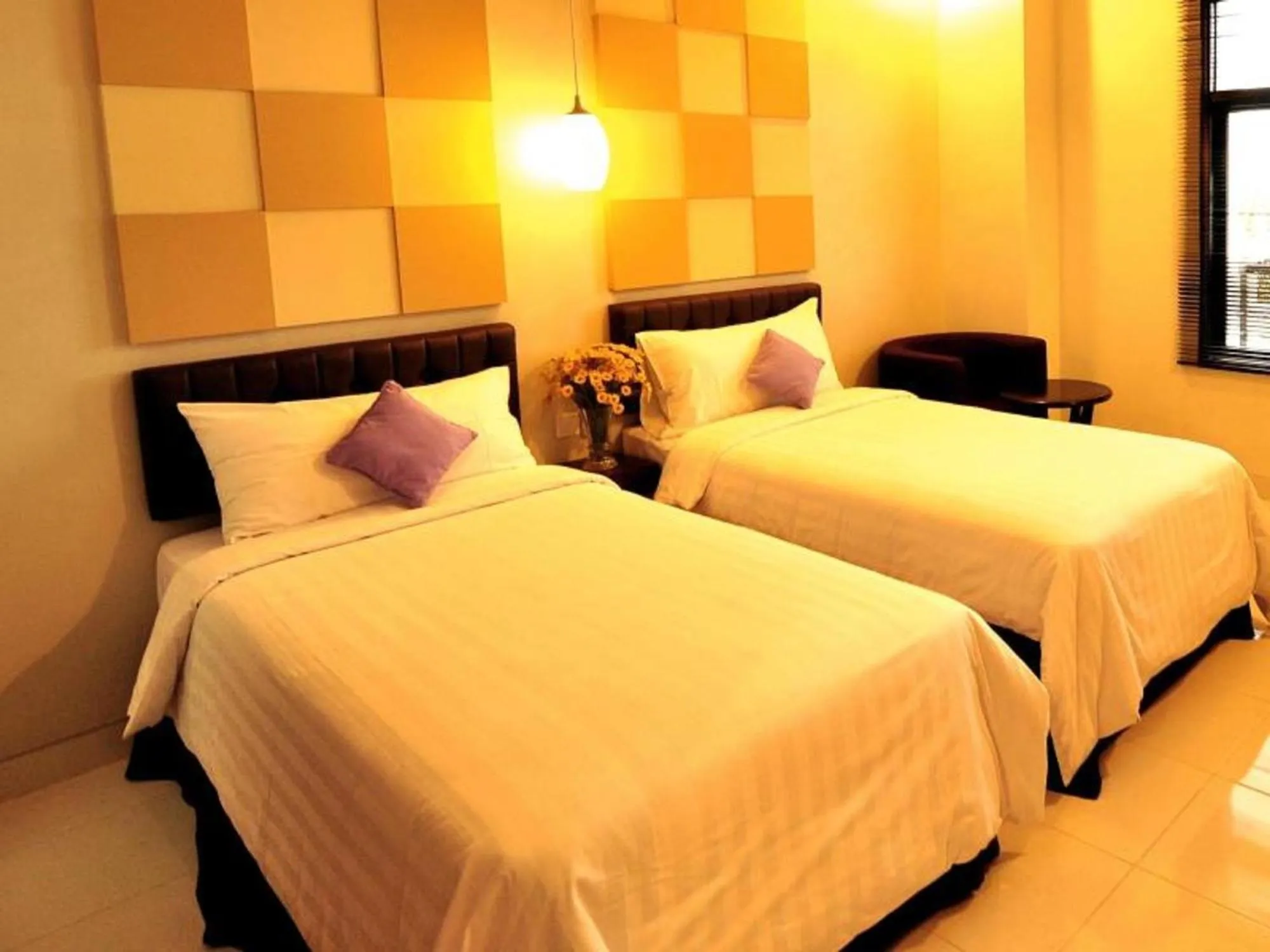 Bed in Aston Ketapang City Hotel