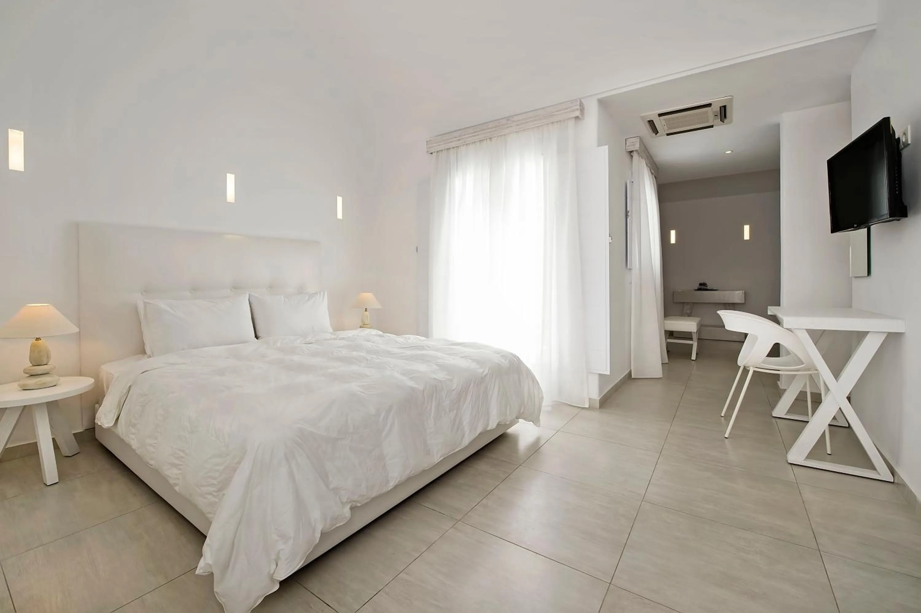 Photo of the whole room, Bed in Cavo Bianco Boutique Hotel & Spa