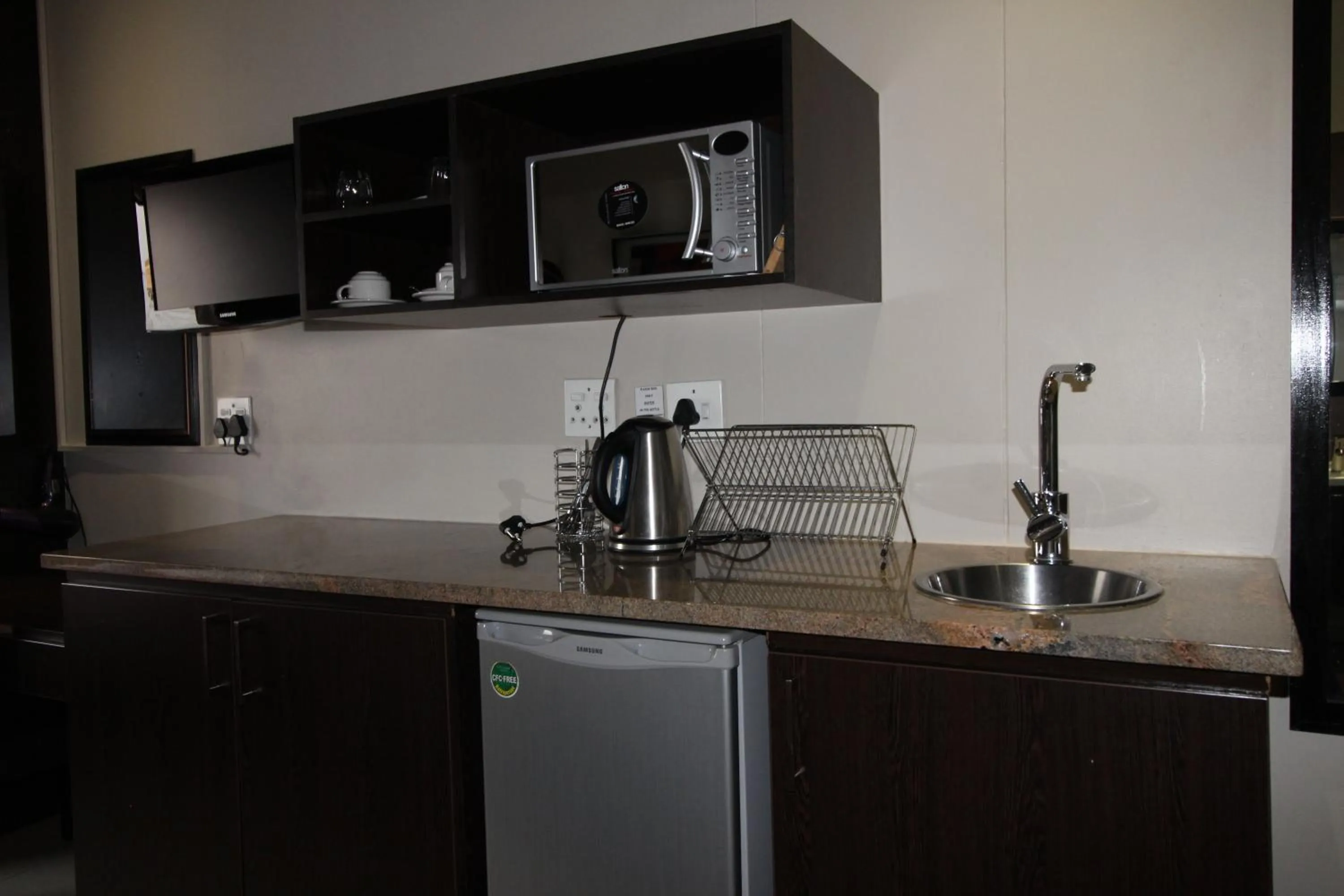 Kitchen or kitchenette in Alcazaba Hotel