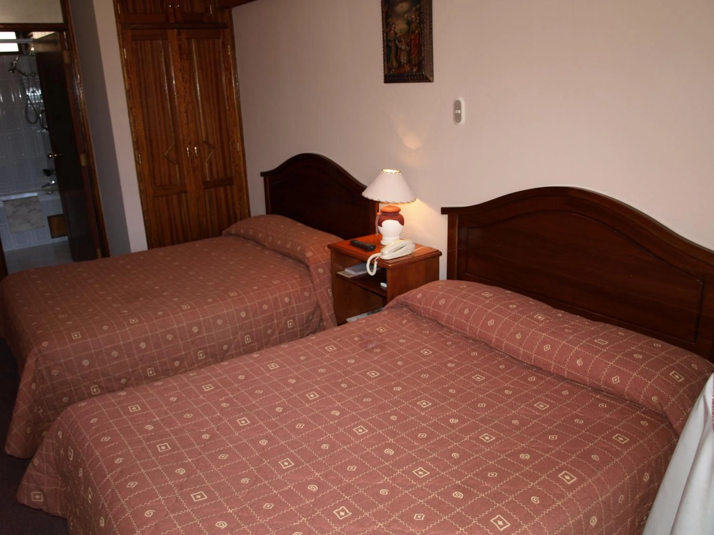 Bed in Qelqatani Hotel